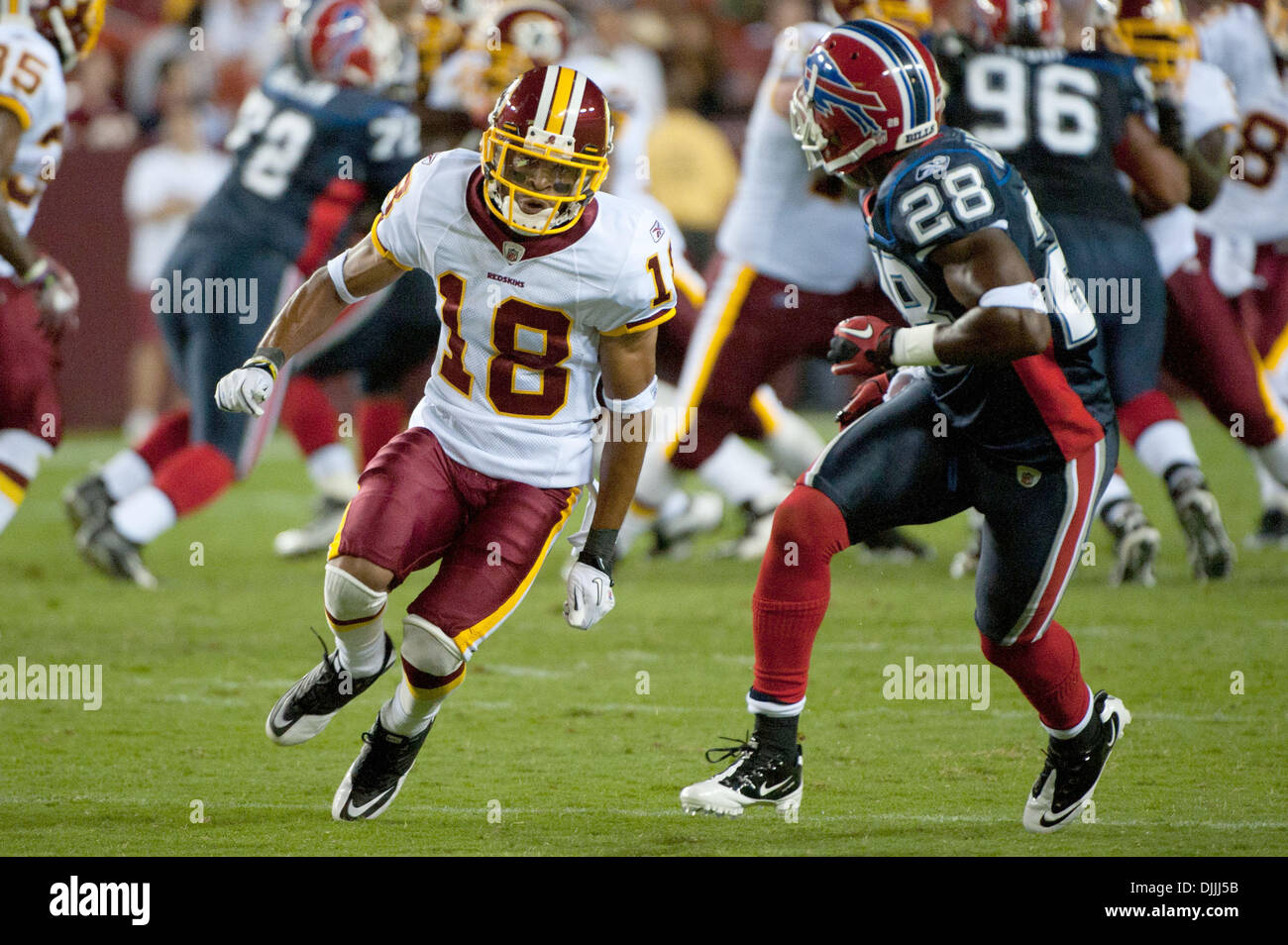Aug. 13, 2010 - Landover, Maryland, United States of America - 13 August, 2010: Washington Redskins Wide Receiver TERRENCE AUSTIN (#18) tried to evade Buffalo Bills Cornerback LEODIS MCKELVIN (#28) during the second quarter of their preseason game at FedEx Field in Landover, MD..Mandatory Credit: Rassi Borneo / Southcreek Global (Credit Image: Â© Southcreek Global/ZUMApress.com) Stock Photo