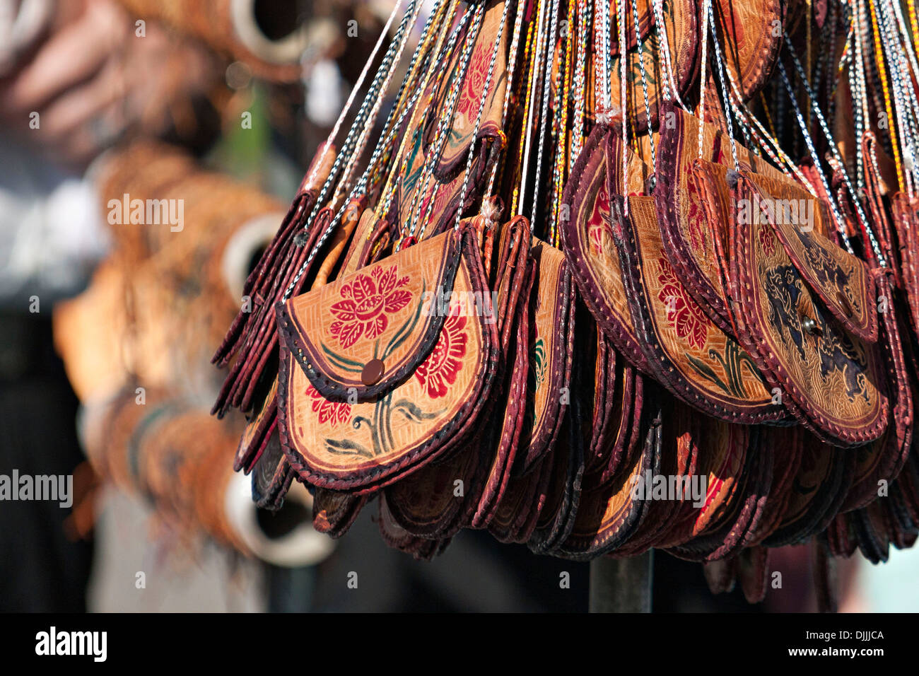 Small Leather Bags hanging on display stand Stock Photo Alamy