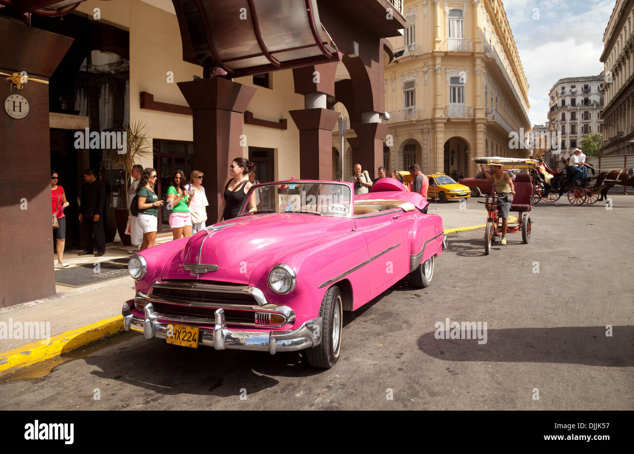 A n old american car taxi waiting on the street outside the Parque Centrale Hotel, Havana, Cuba, Caribbean, Latin America Stock Photo