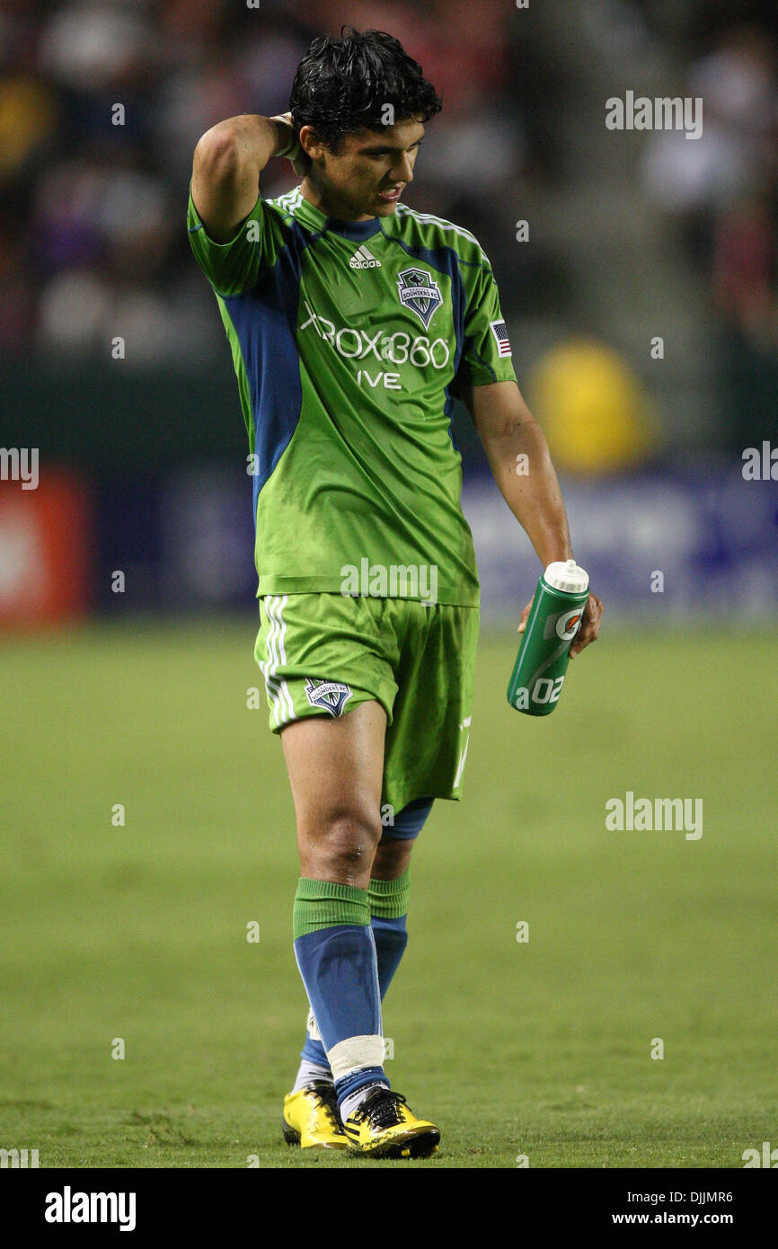 Aug. 14, 2010 - Carson, California, United States of America - 14 August 2010: Seattle Sounders FC forward (#17) FREDY MONTERO shakes off a mid air collision between himself and Zach Thornton during the Chivas USA vs Seattle Sounders game at the Home Depot Center in Carson, California. The Sounders went on to tie Chivas USA with a final score of 0-0. Mandatory Credit: Brandon Parry Stock Photo