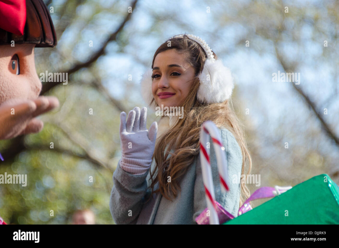 NEW YORK, NY, USA, Nov. 28, 2013. Ariana Grande waves from the Dora the Explorer float in the 87th Annual Macy’s Thanksgiving Day Parade. Credit:  Jennifer Booher/Alamy Live News Stock Photo