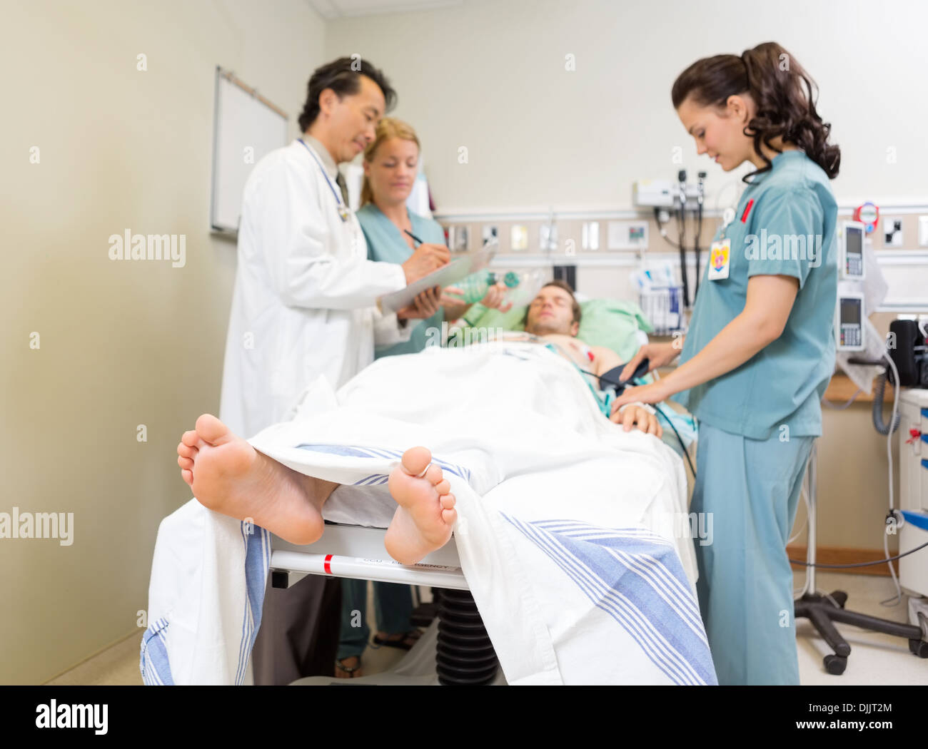 Medical Team And Patient In Hospital Stock Photo