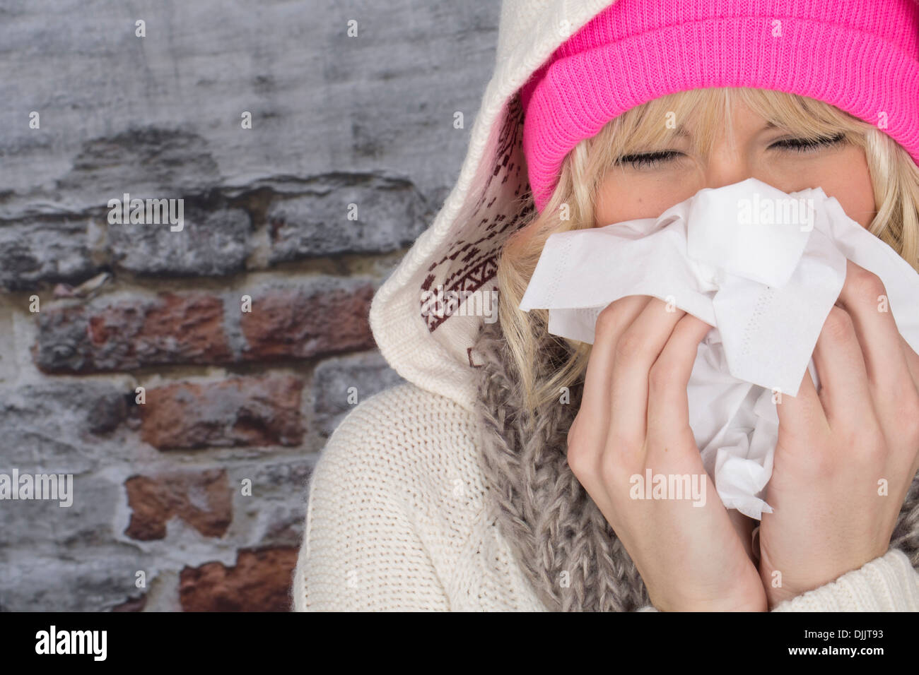 Young Woman With A Temperature And Cough, Showing Symptoms Of Coronavirus Or Covid19 Contagious
