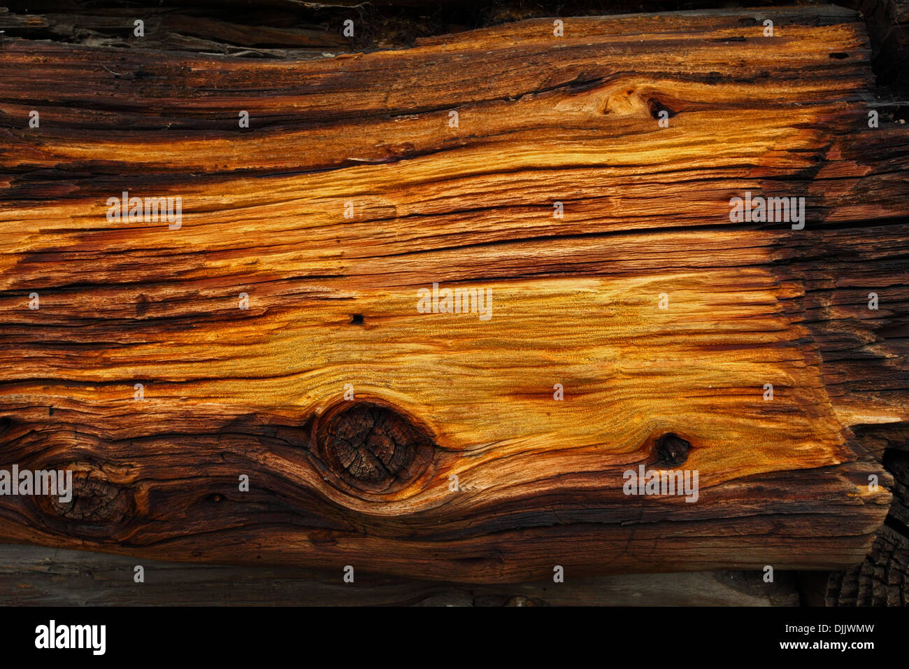 Detail of weatherworn spruce wood used as a building material on old log cottages. Stock Photo