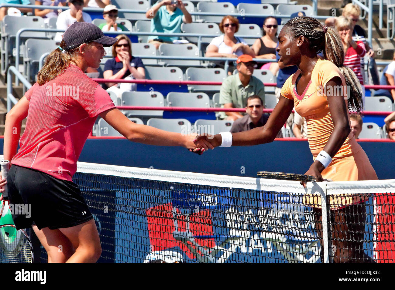 Aug. 20, 2010 - Montreal, Quebec, Canada - EVENGELINE REPIC (L) shakes hands with FRANCOISE ABANDA (R) at the end of the Girl's Under 16 National Championship at  Uniprix Stadium in Montreal, Quebec, Canada. ABANDA won, 6-2, 6-1. (Credit Image: © Leon Switzer/Southcreek Global/ZUMApress.com) Stock Photo