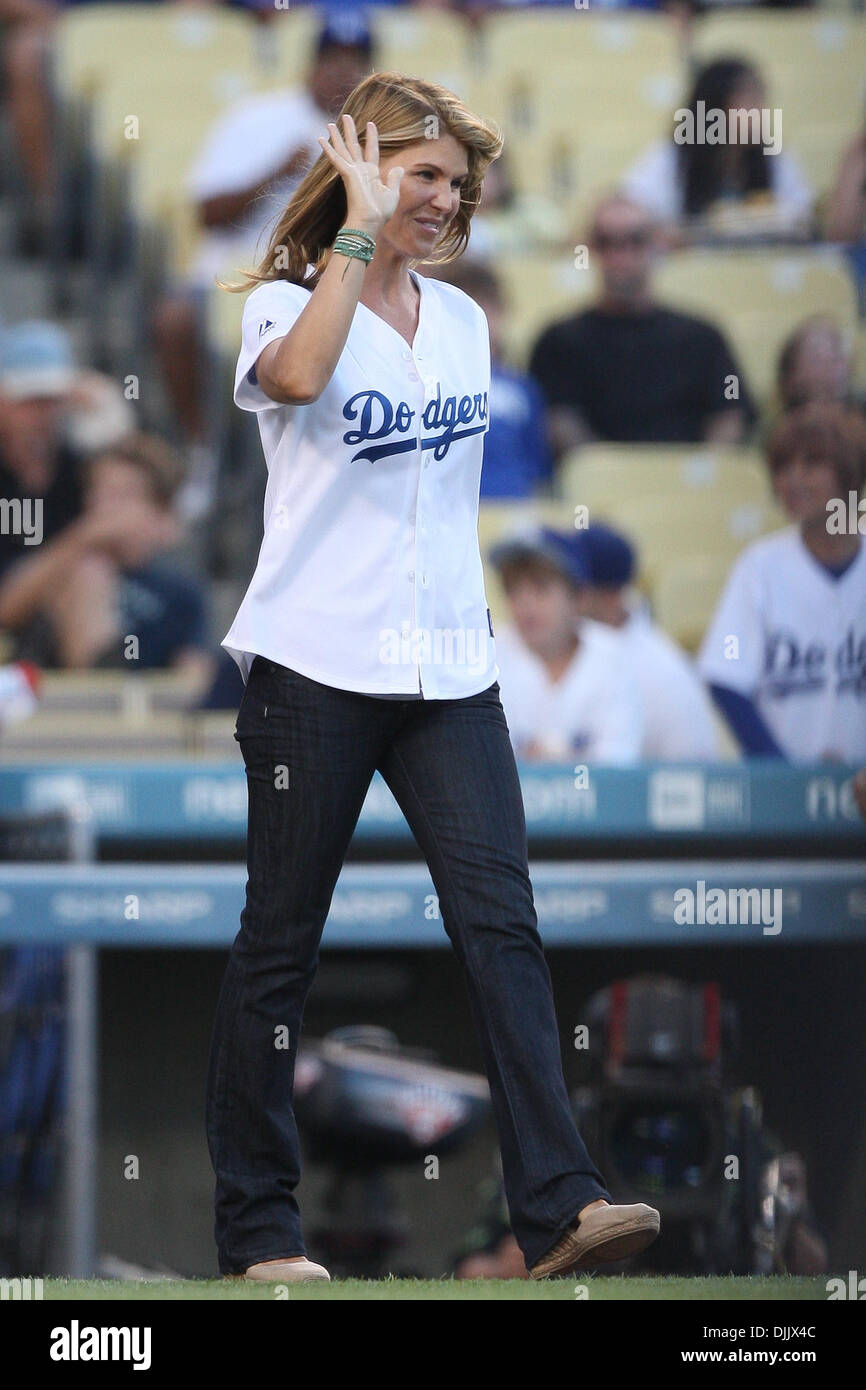 Aug. 20, 2010 - Los Angeles, California, United States of America - Actress LORI LOUGHLIN from the TV show Full House waves to fans before throwing out the first pitch of the Reds vs. Dodgers game at Dodgers Stadium in Los Angeles, California. The Reds went on to defeat the Dodgers with a final score of 3-1. Mandatory Credit: Brandon Parry / Southcreek Global (Credit Image: © Brand Stock Photo