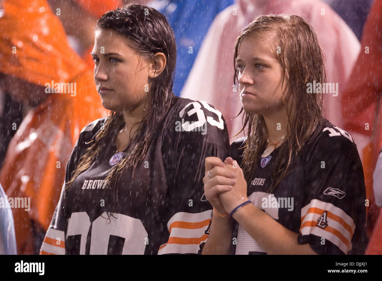 Aug. 21, 2010 - Berea, Ohio, United States of America - Two Cleveland Browns fans show concern as the St. Louis Rams drive toward the end zone during the game against the St. Louis Rams played in the rain at Cleveland Browns Stadium.  The Rams defeated the Browns 19-17.  Mandatory Credit: Frank Jansky / Southcreek Global (Credit Image: © Frank Jamsky/Southcreek Global/ZUMApress.com Stock Photo
