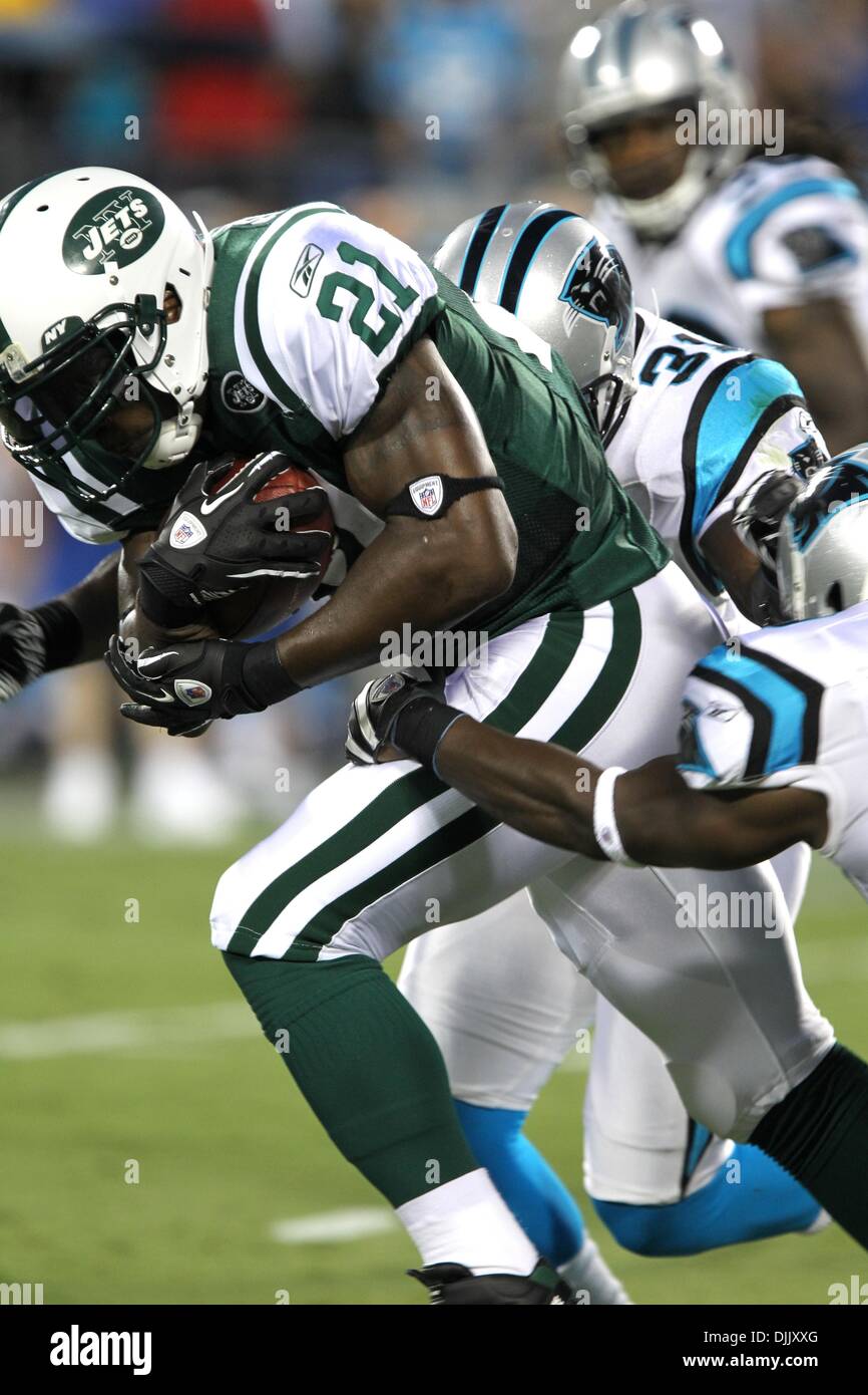 August 21, 2010; New York Jets running back LaDainian Tomlinson (21) runs  for a short gain being brought down by Carolina Panthers cornerback Richard  Marshall (31) at Bank of America Stadium in