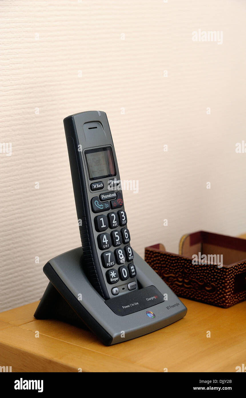 A BT cordless dect house phone on a side table Stock Photo Alamy