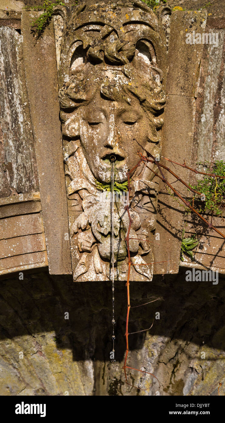 Female fountain head keystone over a pool designed by Edwin Lutyens in Hestercombe Gardens near Taunton Somerset UK Stock Photo