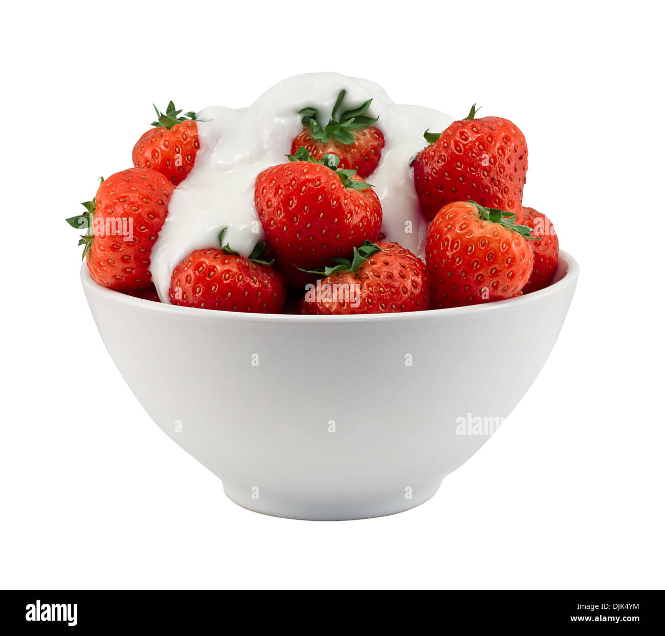 Strawberries and cream in a bowl isolated against a white background Stock Photo