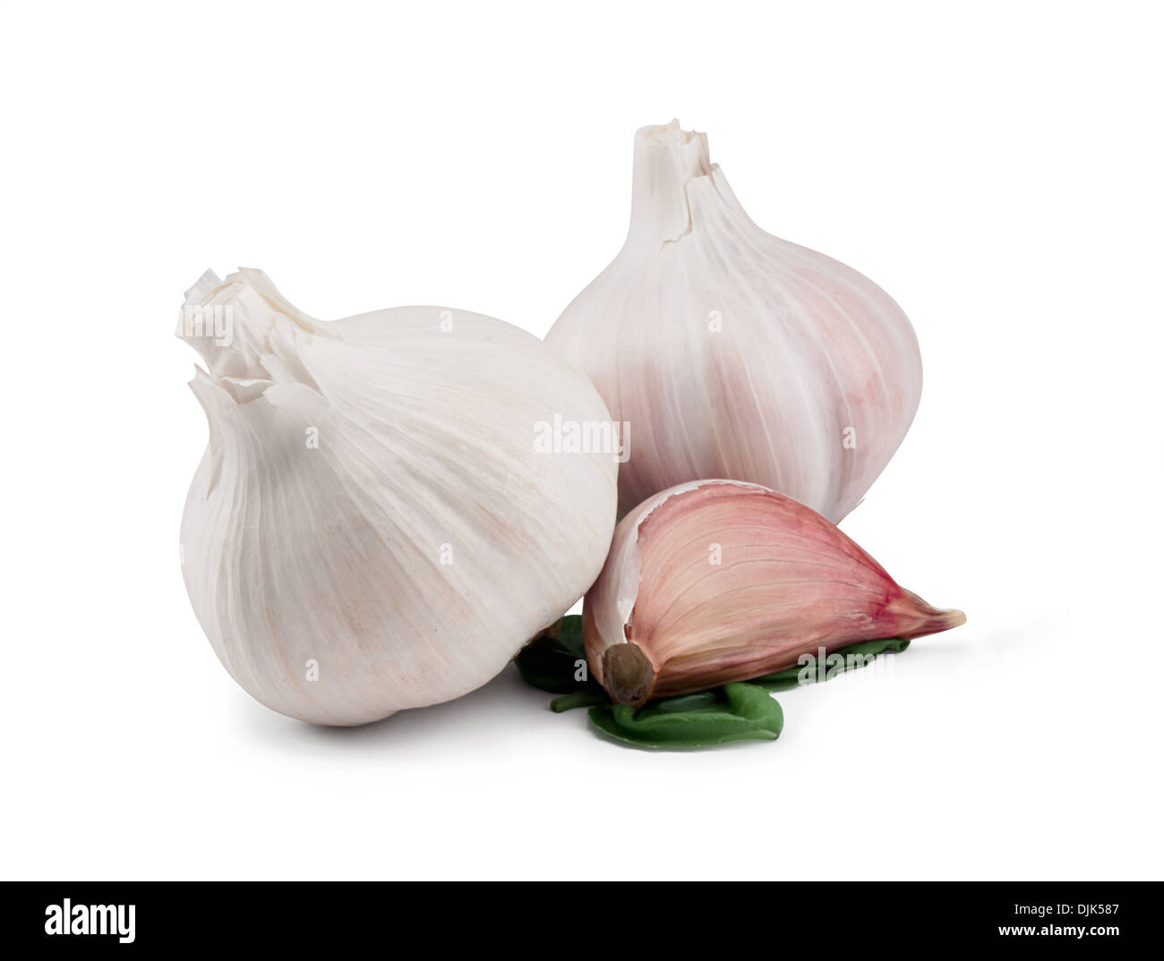 Pair of Garlic Bulbs and a clove isolated against a white background Stock Photo