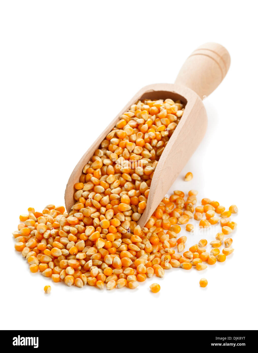 Dried corn kernels in wooden scoop on white background Stock Photo Alamy