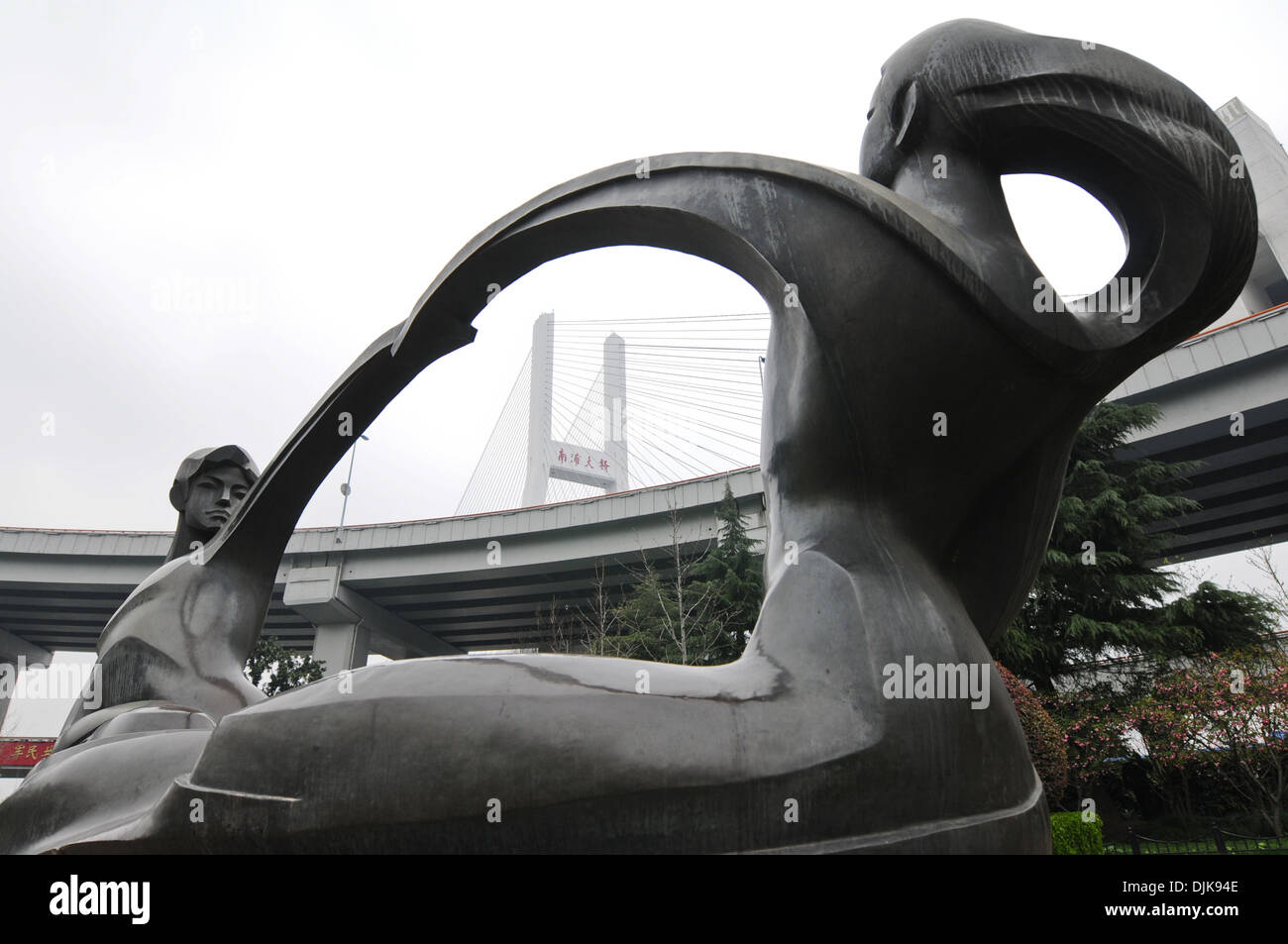 Modern statue next to The Nanpu Bridge in Shanghai, China Stock Photo