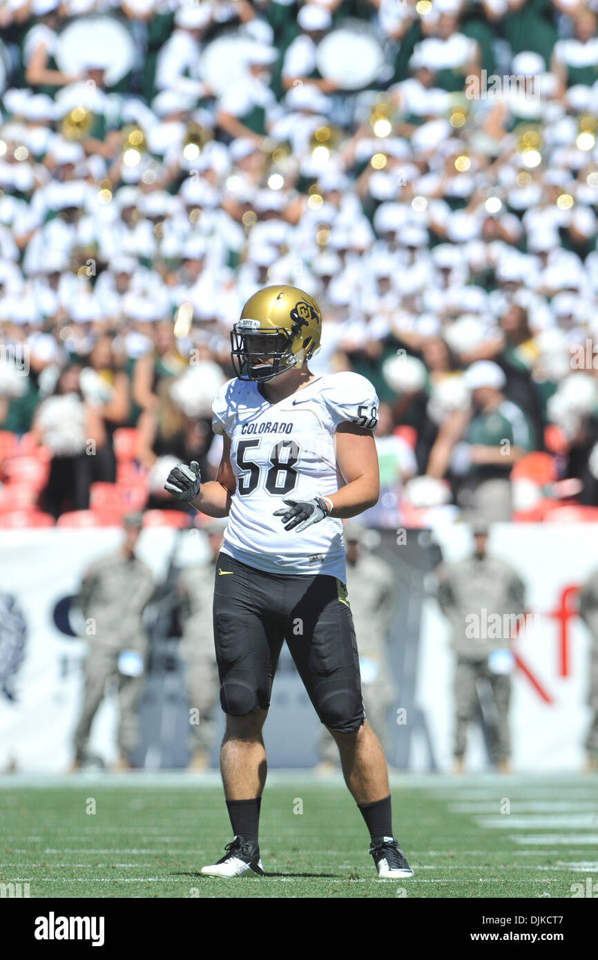 Sep. 04, 2010 - Denver, Colorado, United States of America - Colorado Buffaloes linebacker Tyler Ahles (58) stands on the field with the Colorado State marching band in the stands behind him in the first half of the Rocky Mountain Showdown between the Colorado State Rams and the Colorado Buffaloes at Invesco Field at Mile High. Colorado defeated Colorado State by a score of 24-3. ( Stock Photo