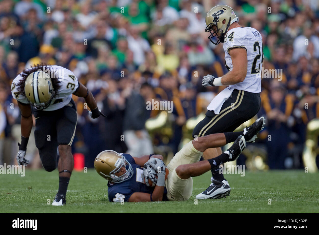 Sep. 04, 2010 - South Bend, Indiana, United States of America - Notre Dame wide receiver TJ Jones (#7) gets hit after reception by Purdue defensive back Jason Werneri (#24) in game action during NCAA football game between the Notre Dame Fighting Irish and the Purdue Boilermakers.  Notre Dame defeated Purdue 23-12 in game at Notre Dame Stadium in South Bend, Indiana. (Credit Image:  Stock Photo