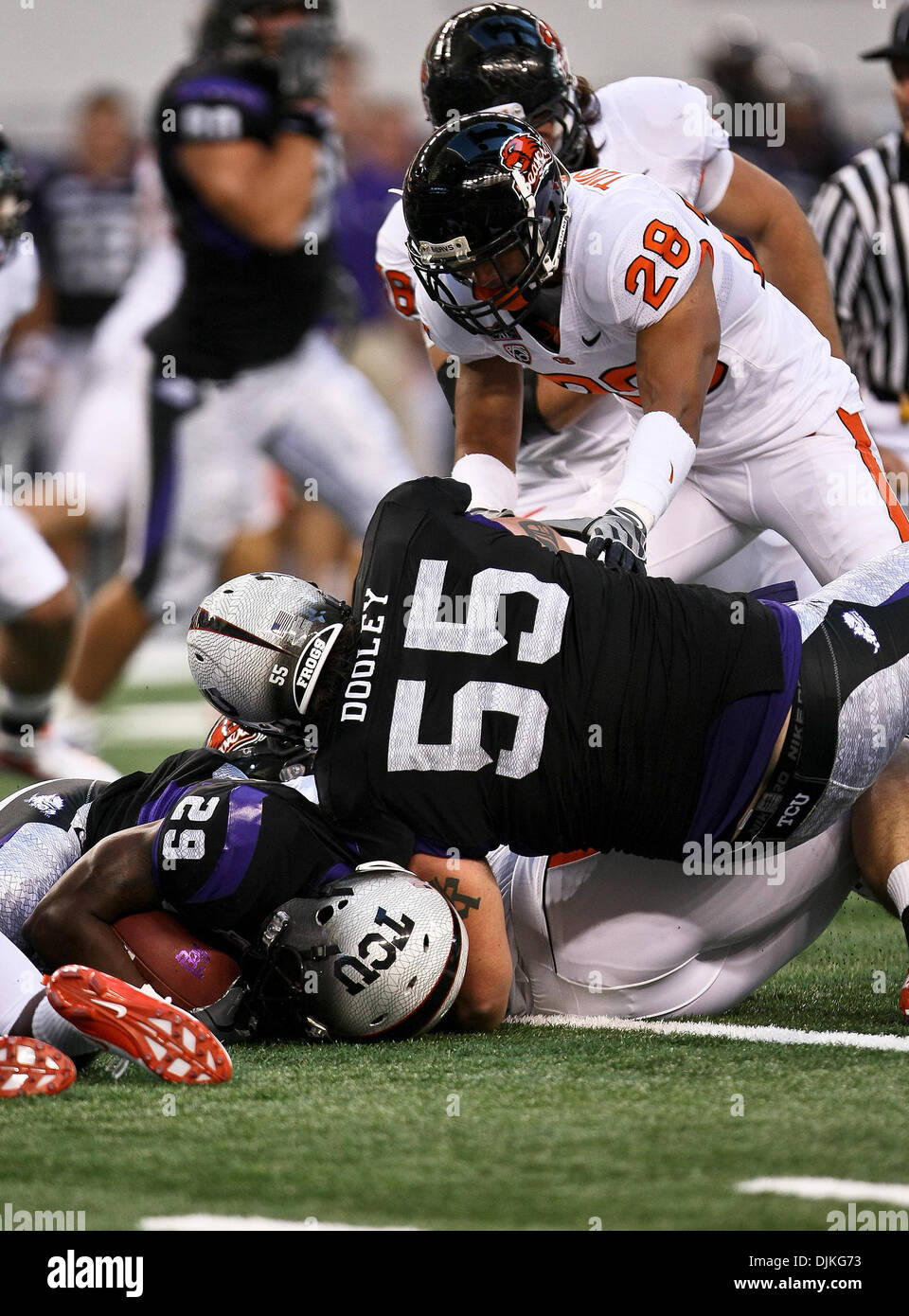 Sep. 06, 2010 - Arlington, Texas, United States of America - TCU Horned Frogs running back Matthew Tucker #29 gets tackled by Oregon State Beavers linebacker Shaydon Akuna #55 during the game between the Oregon State Beavers and the TCU Horned Frogs at the Cowboy Stadium in Arlington,Texas. TCU defeated Oregon State 30-21. (Credit Image: © Dan Wozniak/Southcreek Global/ZUMApress.co Stock Photo
