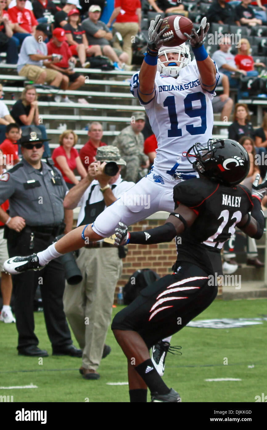 Sept. 11, 2010 - Cincinnati, Ohio, United States of America - Indiana State Sycamores wide receiver Justin Hilton (19) while being covered by Cincinnati Bearcats cornerback Reuben Haley (23) catches the ball but comes down out of bounds during the second half of the game between the University of Cincinnati and Indiana State at Nippert Stadium, Cincinnati, Ohio. Cincinnati won with Stock Photo