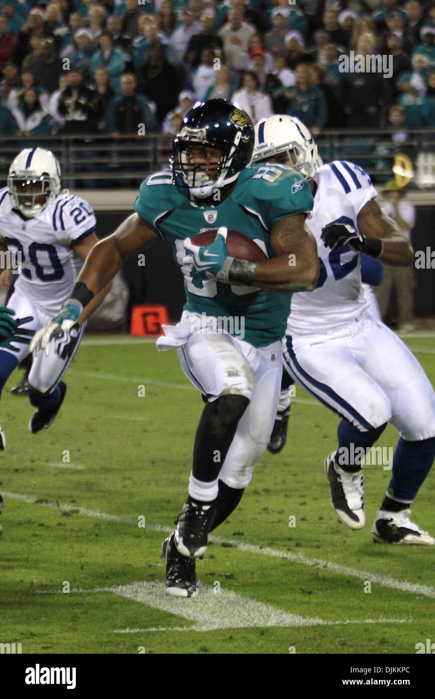 New York Giants cornerback Courtney Brown (37) tackles Jacksonville Jaguars  wide receiver Mike Thomas (80) during first half week 12 NFL action between  the New York Giants and Jacksonville Jaguars at New