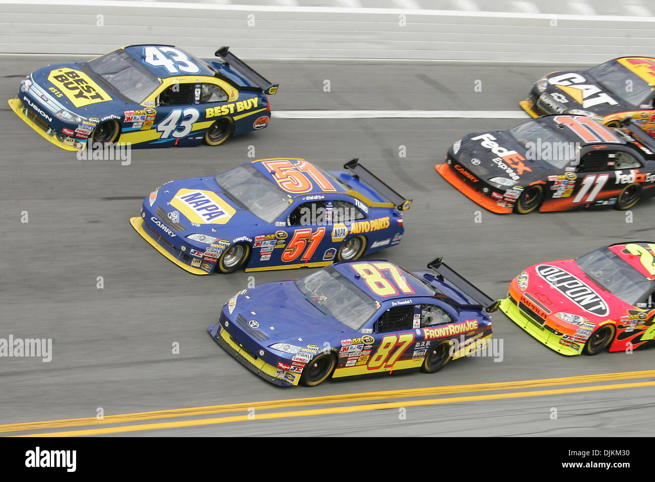 AJ Allmendinger (#43), Micheal Waltrip (#51) and Joe Nemechek (#87) run
