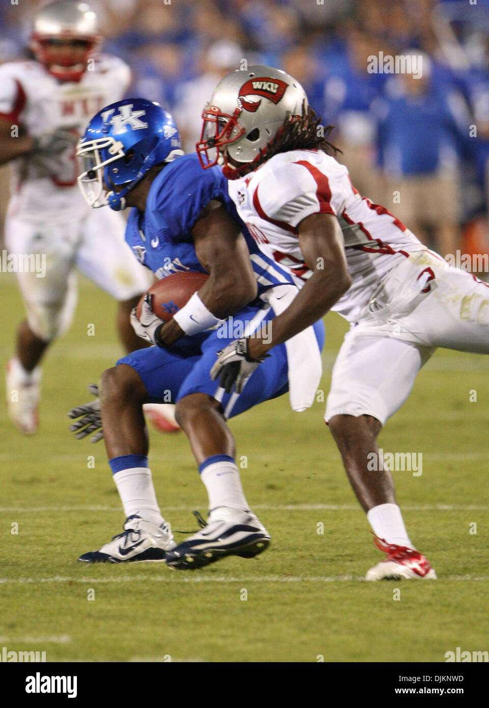 Sept. 11, 2010 - Lexington, Kentucky, United States of America - Kentucky wide receiver Randall Cobb (18)  breaks the tackle of Western Kentucky defensive back Jamal Forrest (18) in first half action from Commonwealth Stadium in Lexington. (Credit Image: © Wayne Litmer/Southcreek Global/ZUMApress.com) Stock Photo
