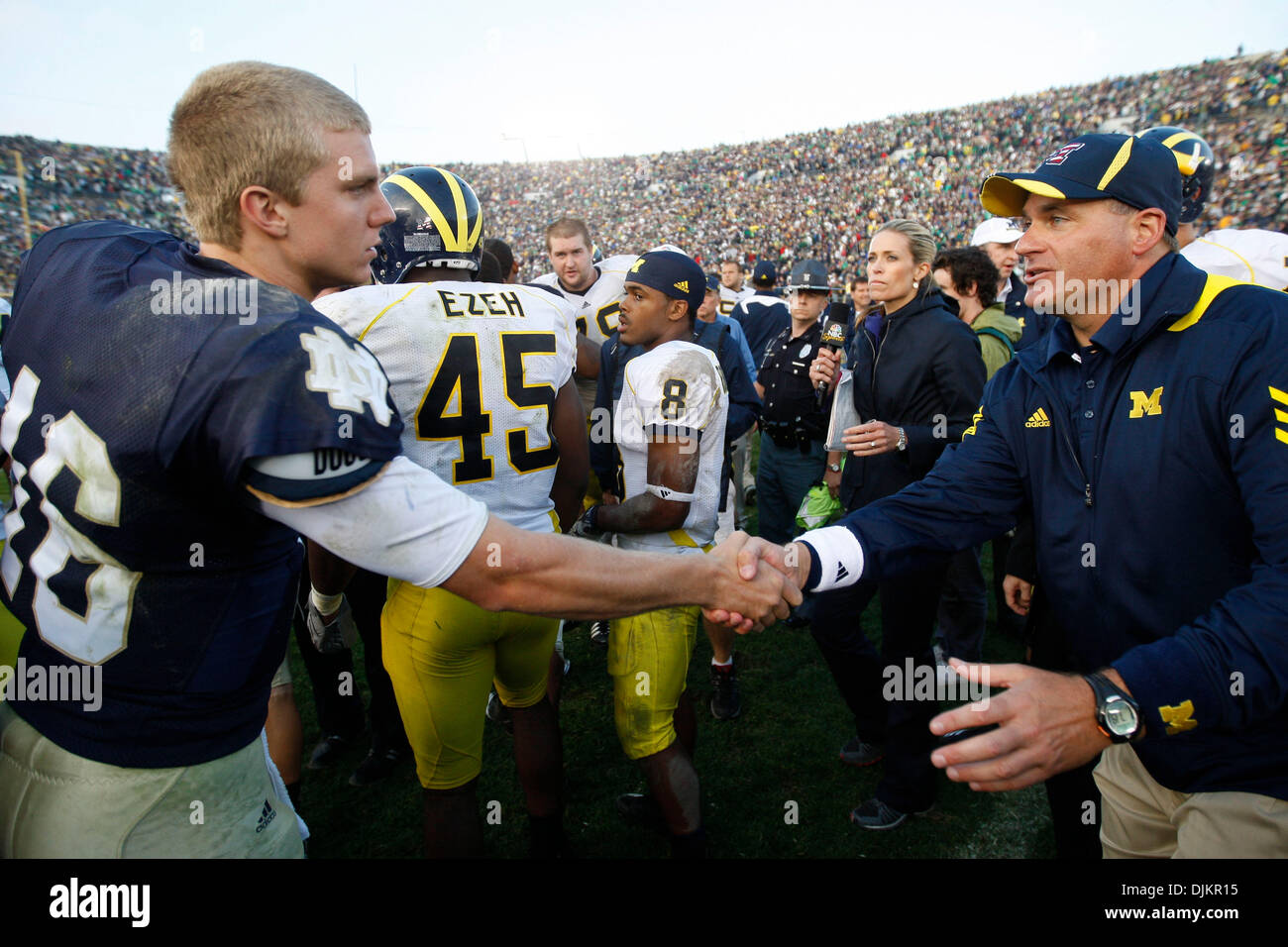 Sept. 11, 2010 - South Bend, Indiana, USA - University of Michigan coach Rich Rodriguez shakes hands with Notre Dame quarterback Nate Montana Saturday September 11, 2010 after Michigan beat Notre Dame 28-24 at Notre Dame Stadium in South Bend, Indiana. (Credit Image: © Jim Z. Rider/ZUMApress.com) Stock Photo