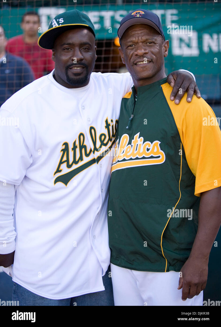 Sept. 11, 2010 - Oakland, California, U.S. - During pre-game ceremonies for the Aâ€™s Firefighter Appreciation Night Oakland Athletics Hall of Famer RICKEY HENDERSON poses with SYLVESTER WIGGINS, a Richmond, CA man who forced his way into a burning building to save a trapped family. (Credit Image: © William Mancebo/ZUMApress.com) Stock Photo