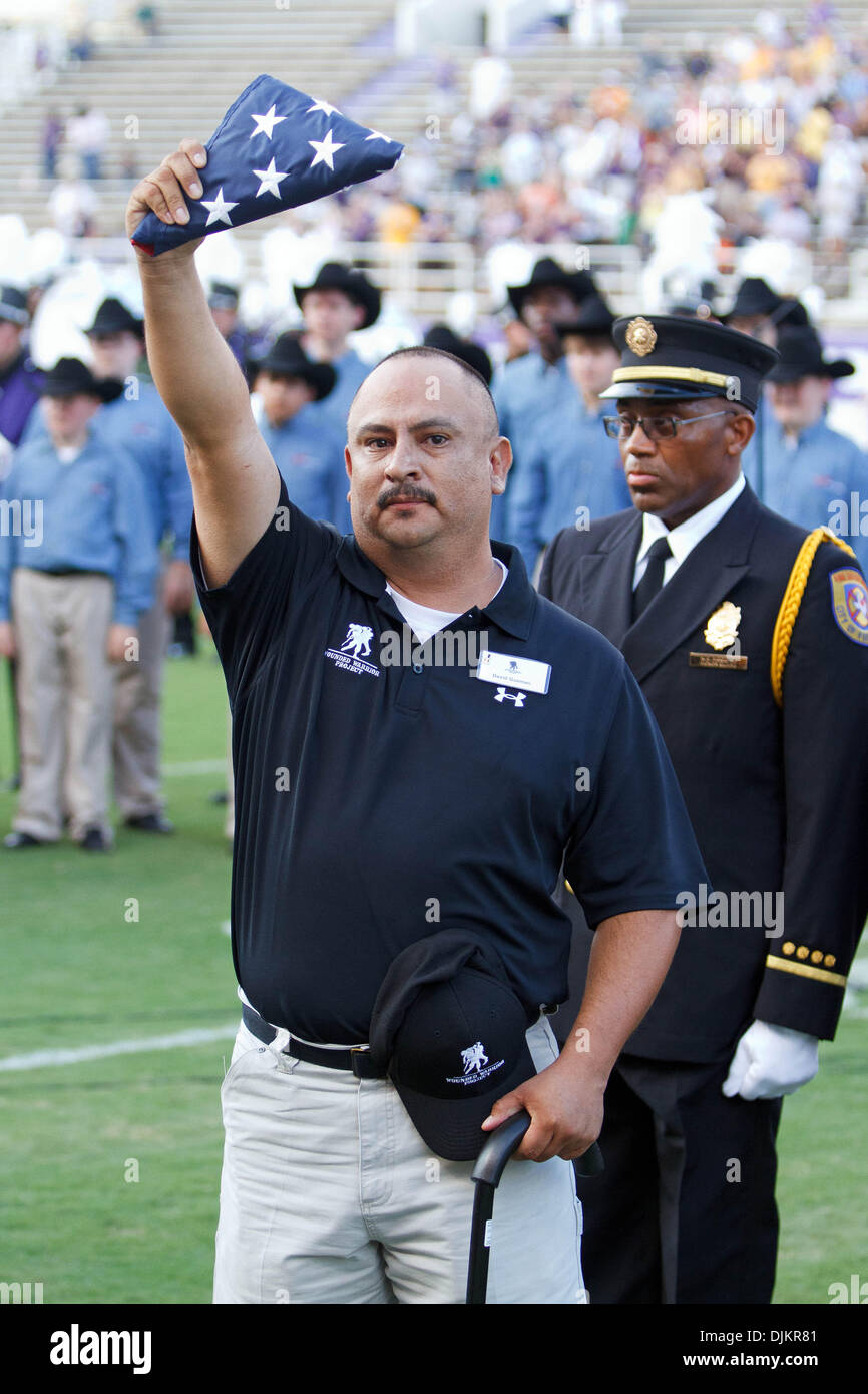 Sept. 11, 2010 - Fort Worth, Texas, United States of America - Purple Heart recipient David Guzman receives a flag during a special pregame ceremony.  TCU wins the game 62-7 at Amon G. Carter Stadium (Credit Image: © Andrew Dieb/Southcreek Global/ZUMApress.com) Stock Photo
