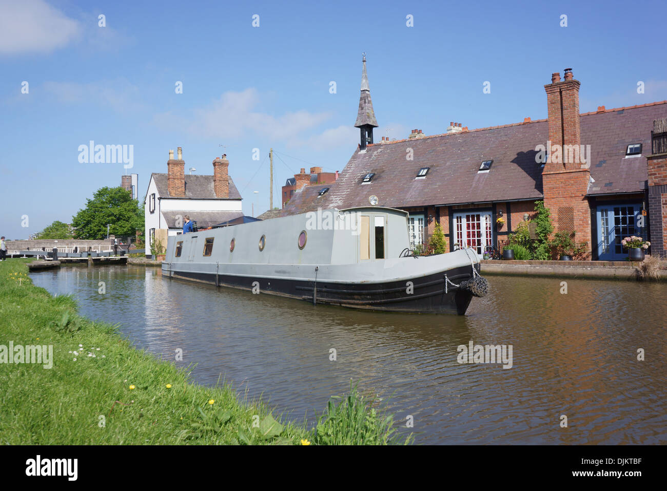 A canal narrowboat travels up the Chester Canal Stock Photo Alamy