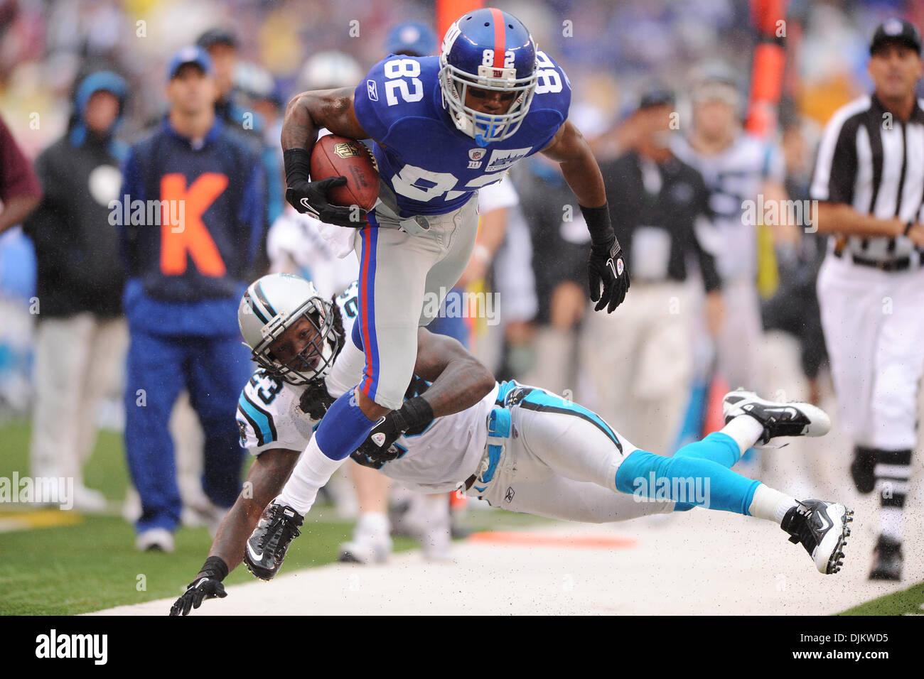 Carolina Panthers safety Sherrod Martin (23) catches New York Giants wide  receiver Mario Manningham (82) on a long catch and run during second half  NFL action in the New York Giants' 31-18