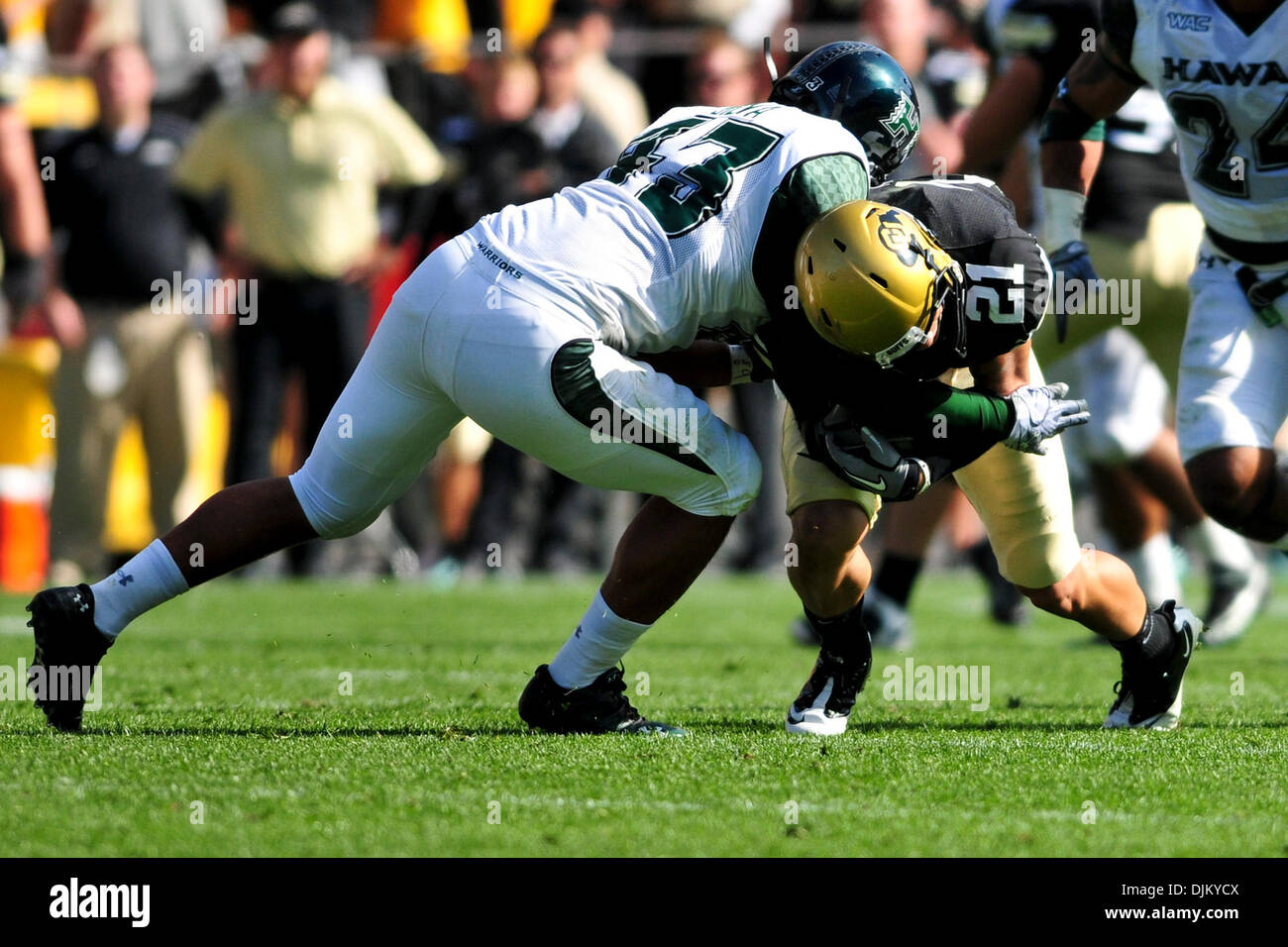 Sept. 17, 2010 - Boulder, Colorado, United States of America - Colorado Buffalos Scotty McKnight (21) gets tackled by Hawaii defensive tackle Zach Masch (47) in the second half at Folsom Field. Colorado defeated Hawaii 31-13. (Credit Image: © Michael Furman/Southcreek Global/ZUMApress.com) Stock Photo