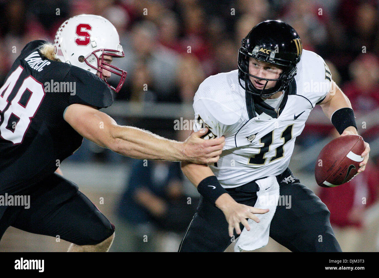 Sept. 18, 2010 - Stanford, California, United States of America - Sept 18, 2010: Stanford, Calif. - Lake Forest QB Tanner Price (11) is sacked by Stanford FB Owen Merecic (48) during game action on Saturday at Stanford Stadium. Stanford leads Wake Forest 41 - 7 late in the first half. (Credit Image: © Konsta Goumenidis/Southcreek Global/ZUMApress.com) Stock Photo