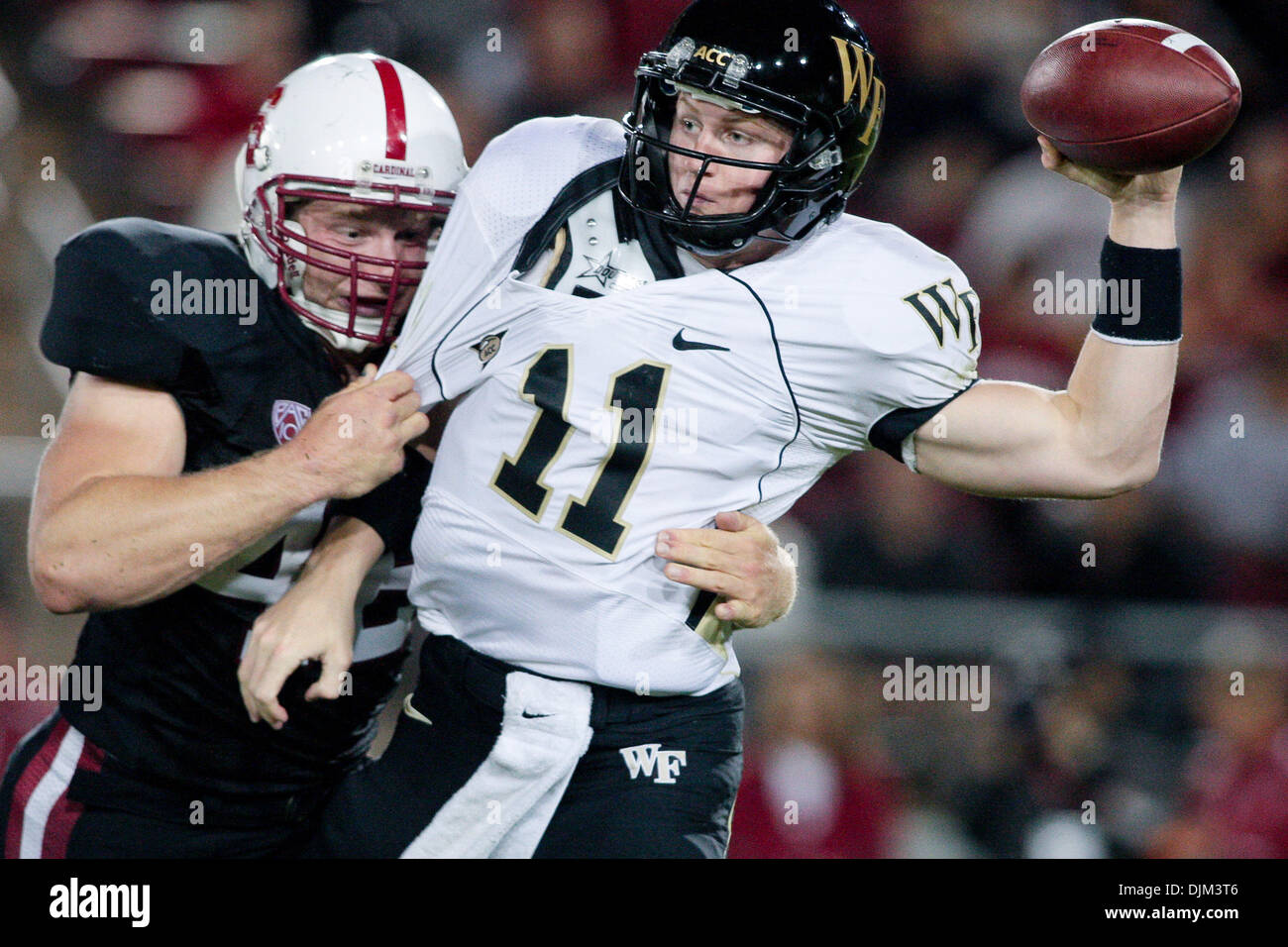Sept. 18, 2010 - Stanford, California, United States of America - Sept 18, 2010: Stanford, Calif. - Lake Forest QB Tanner Price (11) is sacked by Stanford FB Owen Merecic (48) during game action on Saturday at Stanford Stadium. Stanford leads Wake Forest 41 - 7 late in the first half. (Credit Image: © Konsta Goumenidis/Southcreek Global/ZUMApress.com) Stock Photo