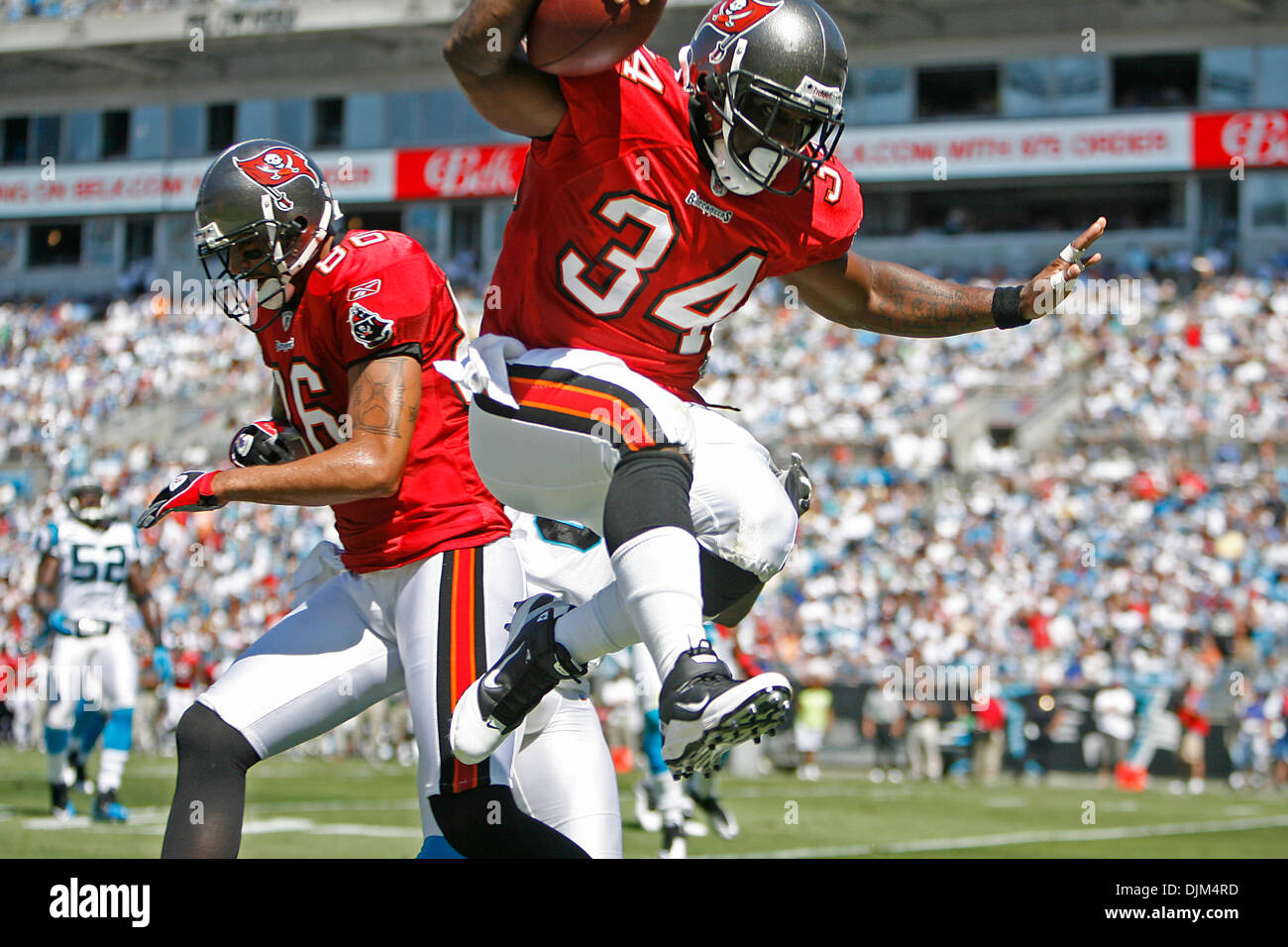 Sept. 19, 2010 - Charlotte, North Carolina, U.S. - Tampa Bay Buccaneers running back EARNEST GRAHAM (34) jumps into the endzone past teammate JERRAMY STEVENS (86) to score a first quarter touch down against the Charlotte Panthers at Bank of America Stadium. (Credit Image: © Chris Zuppa/St. Petersburg Times/ZUMApress.com) Stock Photo