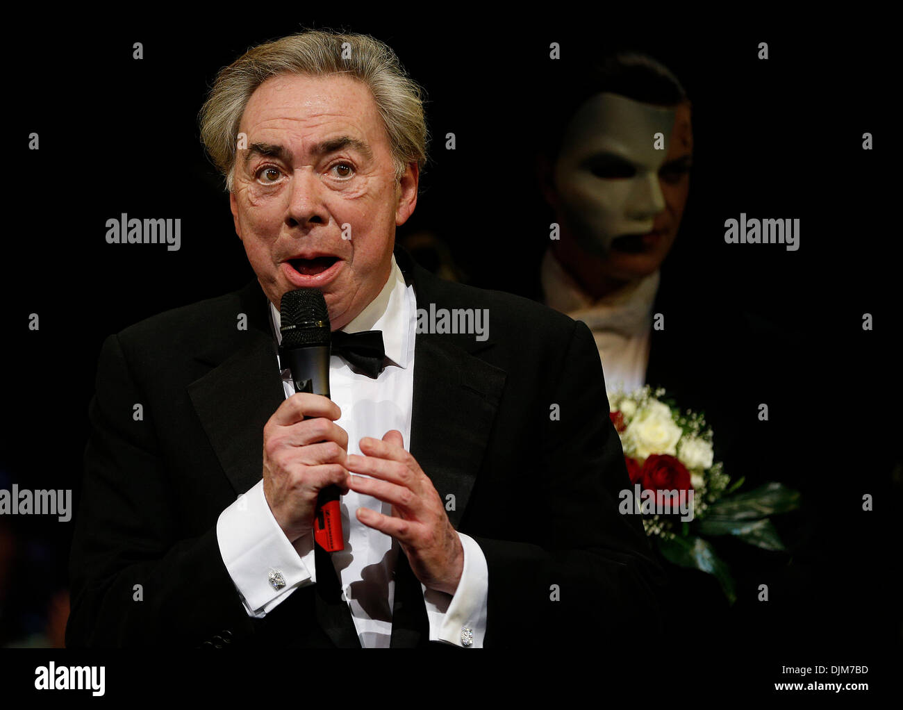 Hamburg, Germany. 28th Nov, 2013. Composer Andrew Lloyd Webber thanks the audience before the premiere of the musical 'Phantom of the Opera' in Hamburg, Germany, 28 November 2013. The musical has returned to Hamburg for ten months. Photo: Axel Heimken/dpa/Alamy Live News Stock Photo