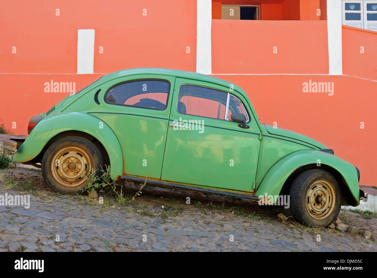 Brazil, Bahia, Lencois: Old historic Volkswagen Beetle parked in one of Lencois' cobblestone roads. Stock Photo