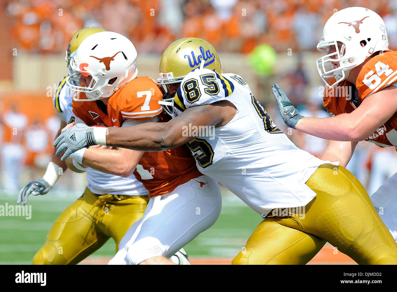 Sept. 25, 2010 - Austin, Texas, United States of America - Texas Longhorns quarterback Garrett Gilbert (7) is sacked by UCLA Bruins defensive tackle David Carter (85) during the game between the University of Texas and UCLA. The Bruins defeated the Longhorns 34-12. (Credit Image: © Jerome Miron/Southcreek Global/ZUMApress.com) Stock Photo