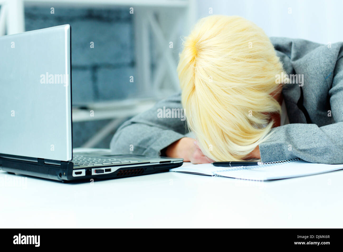 Businesswoman sleeping on her workplace in office Stock Photo - Alamy