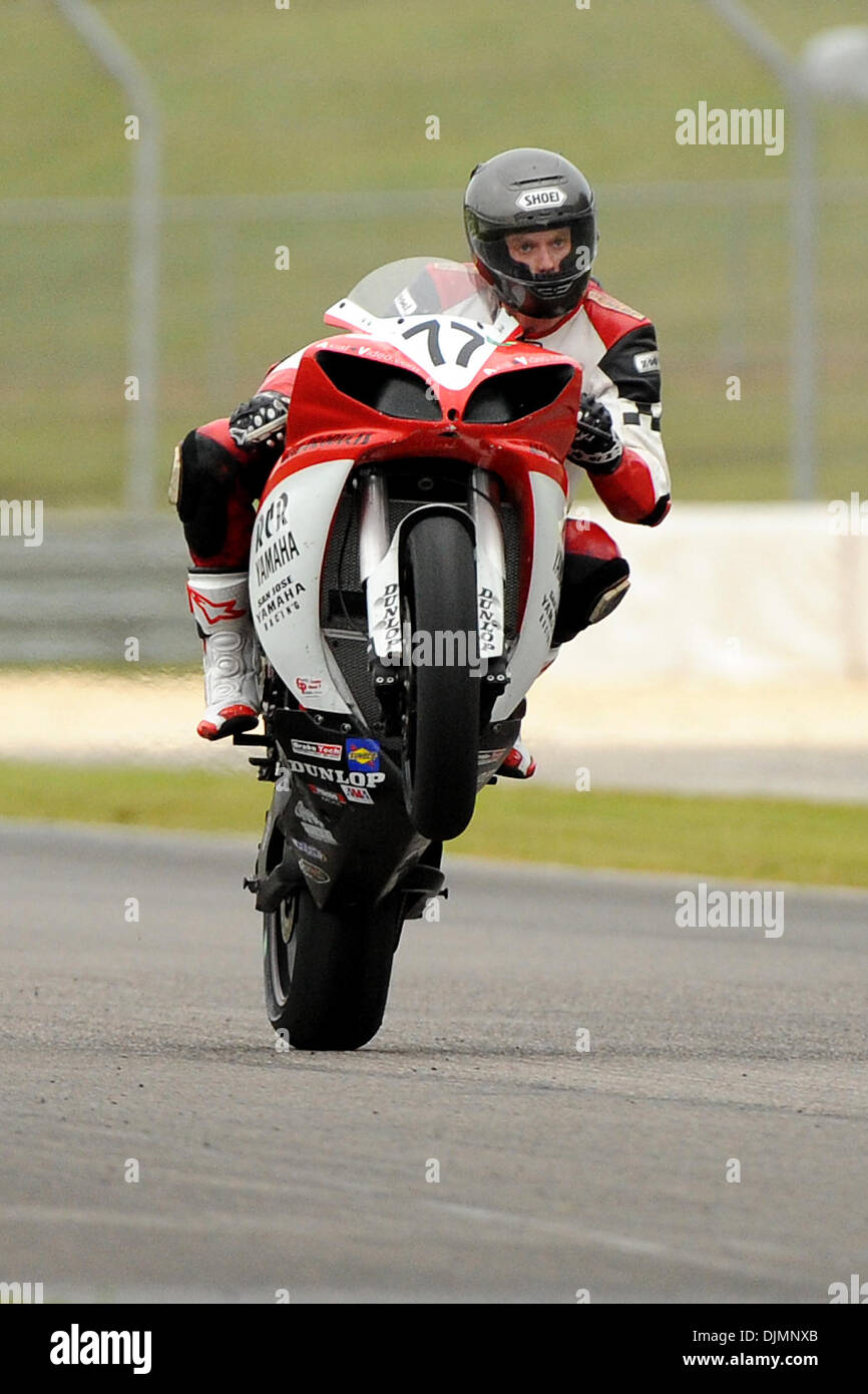 Sept. 26, 2010 - Birmingham, Alabama, United States of America - Ricky Corey, rider of the RCR Yamaha Yamaha YZF-R1, (77) does a wheelie for the fans at the end of the American SuperBike race at Barber Motorsports Park in Birmingham Alabama. (Credit Image: © Marty Bingham/Southcreek Global/ZUMApress.com) Stock Photo