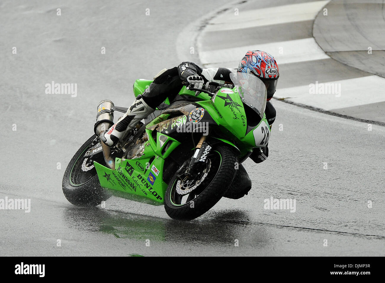 Green Kawasaki Ninja ZX-6R ridden with pillion at the Green Kawasaki Ninja ZX-6R ridden with pillion at the