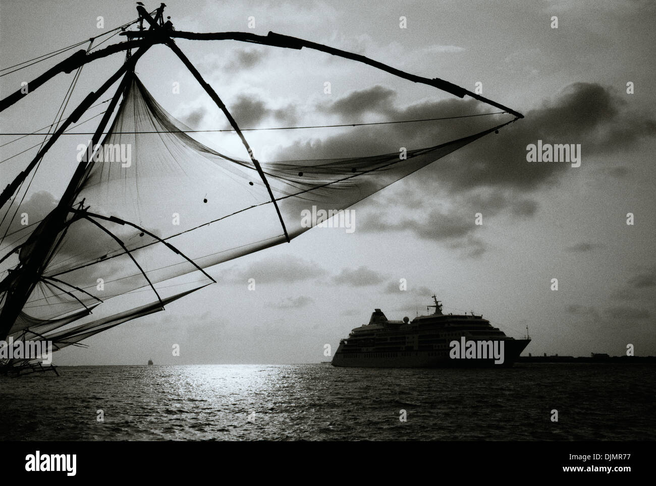 Chinese fishing nets in Fort Kochi Cochin in Kerala in South India in Asia. Fish Net Sea Work Ancient History Landscape Sky Travel Wanderlust Escapism Stock Photo