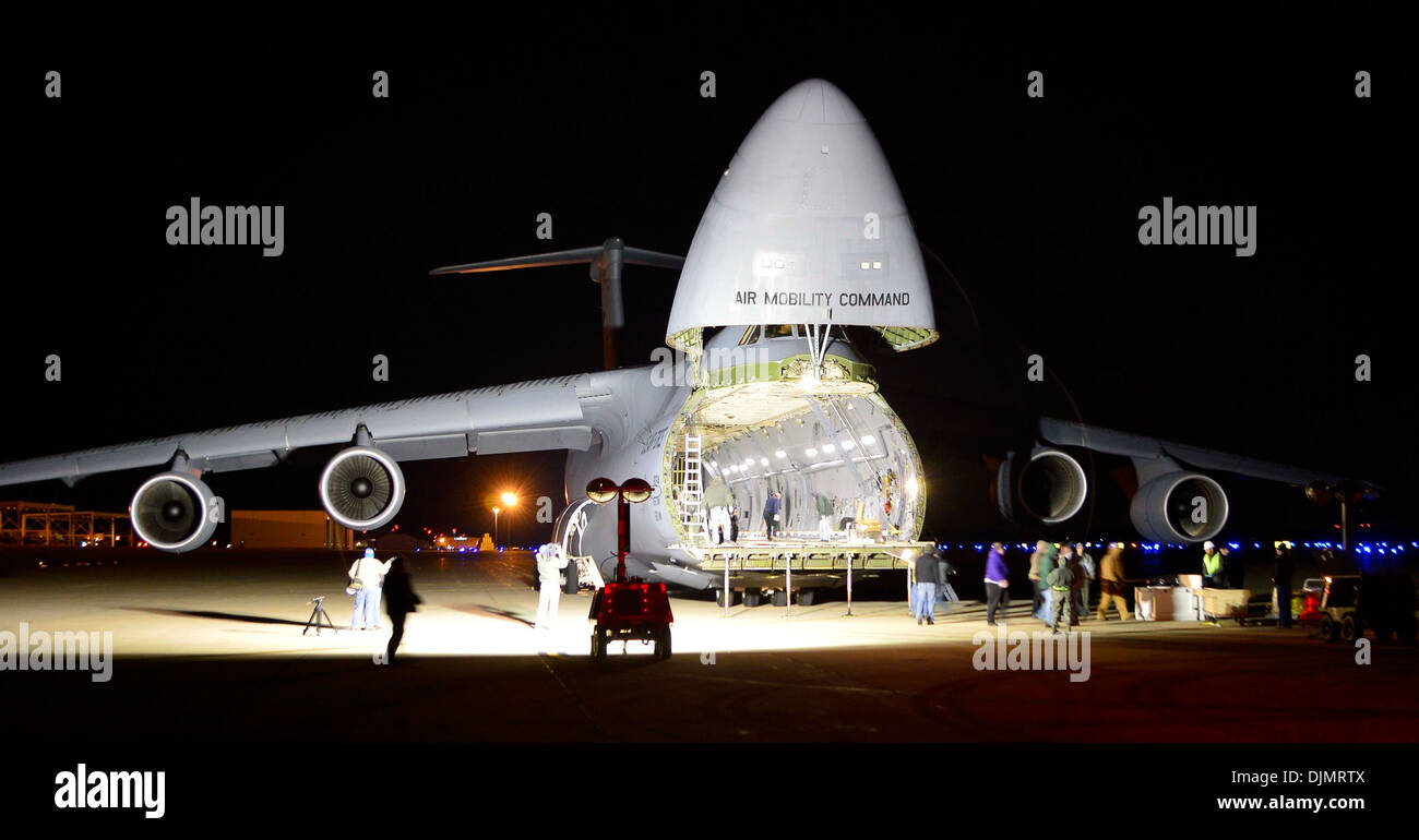 A C-5M Super Galaxy is flooded with lights prior to the load of a Global Precipitation Measurement Satellite Nov. 20, 2013, at Joint Base Andrews, Md. The satellite, its container and support equipment was loaded on the aircraft at the base en route to it Stock Photo