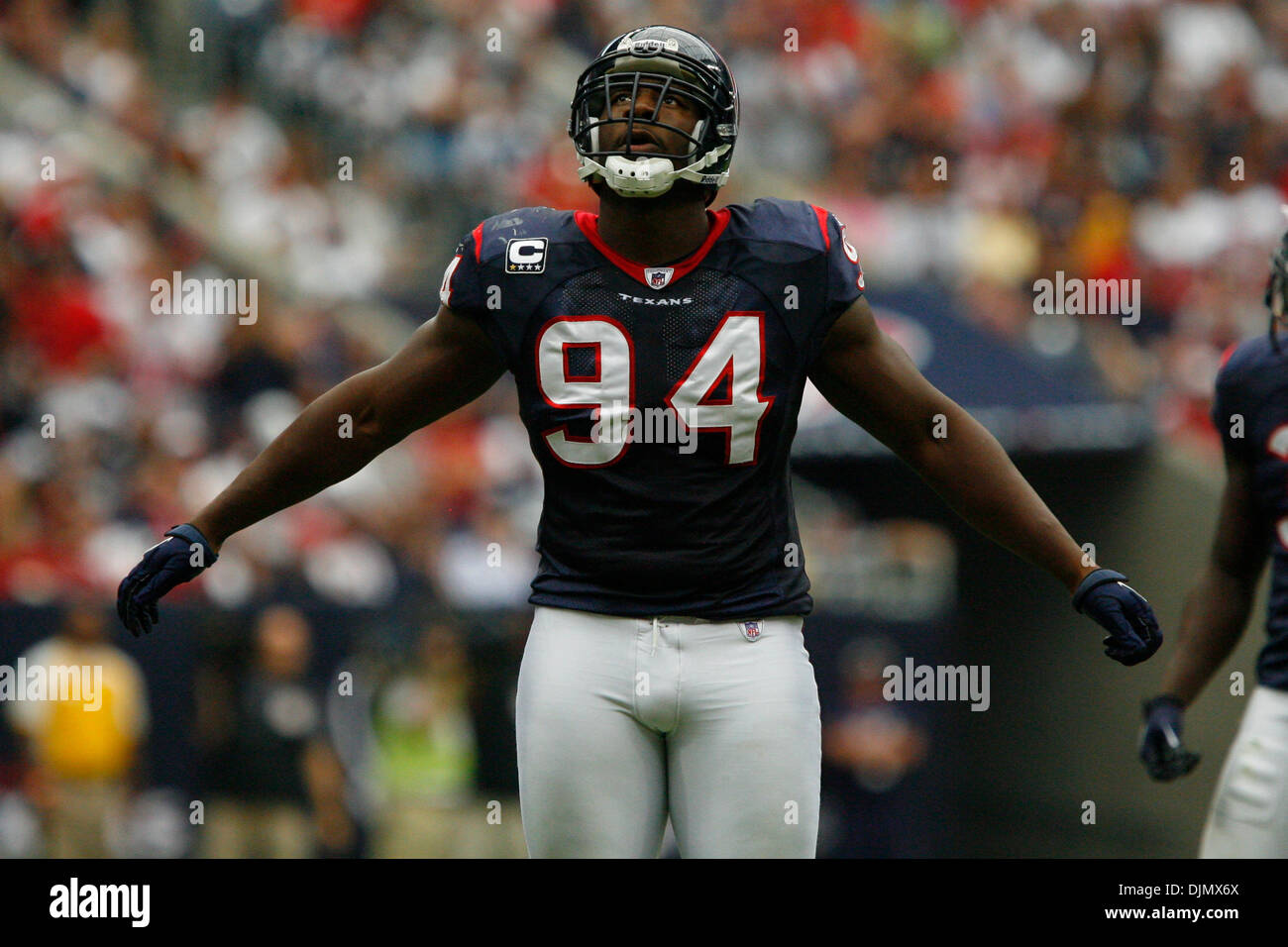 Sept. 26, 2010 - Houston, Texas, United States of America - Houston Texans defensive end Antonio Smith #94 looks up at the scoreboard during a timeout during the game between the Dallas Cowboys and the Houston Texans at Reliant Stadium in Houston, Texas. The Cowboys beat the Texans 27-13. (Credit Image: © Matt Pearce/Southcreek Global/ZUMApress.com) Stock Photo