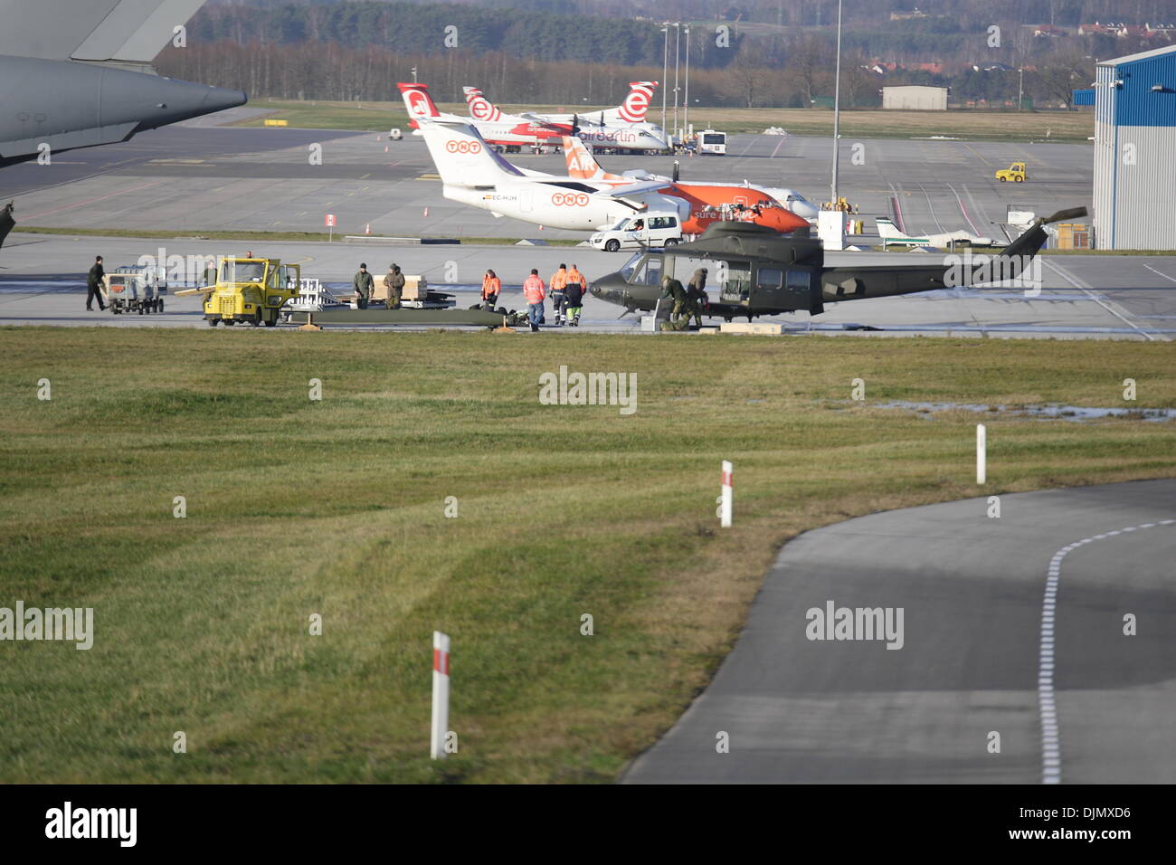 Gdansk, Poland 29th, November 2013 Loading two miliotary Bell 412 helicopters on the giant American transport aircraft  Boeing C-17 Globemaster board at the Gdansk Lech Walesa Airport. Credit:  Michal Fludra/Alamy Live News Stock Photo