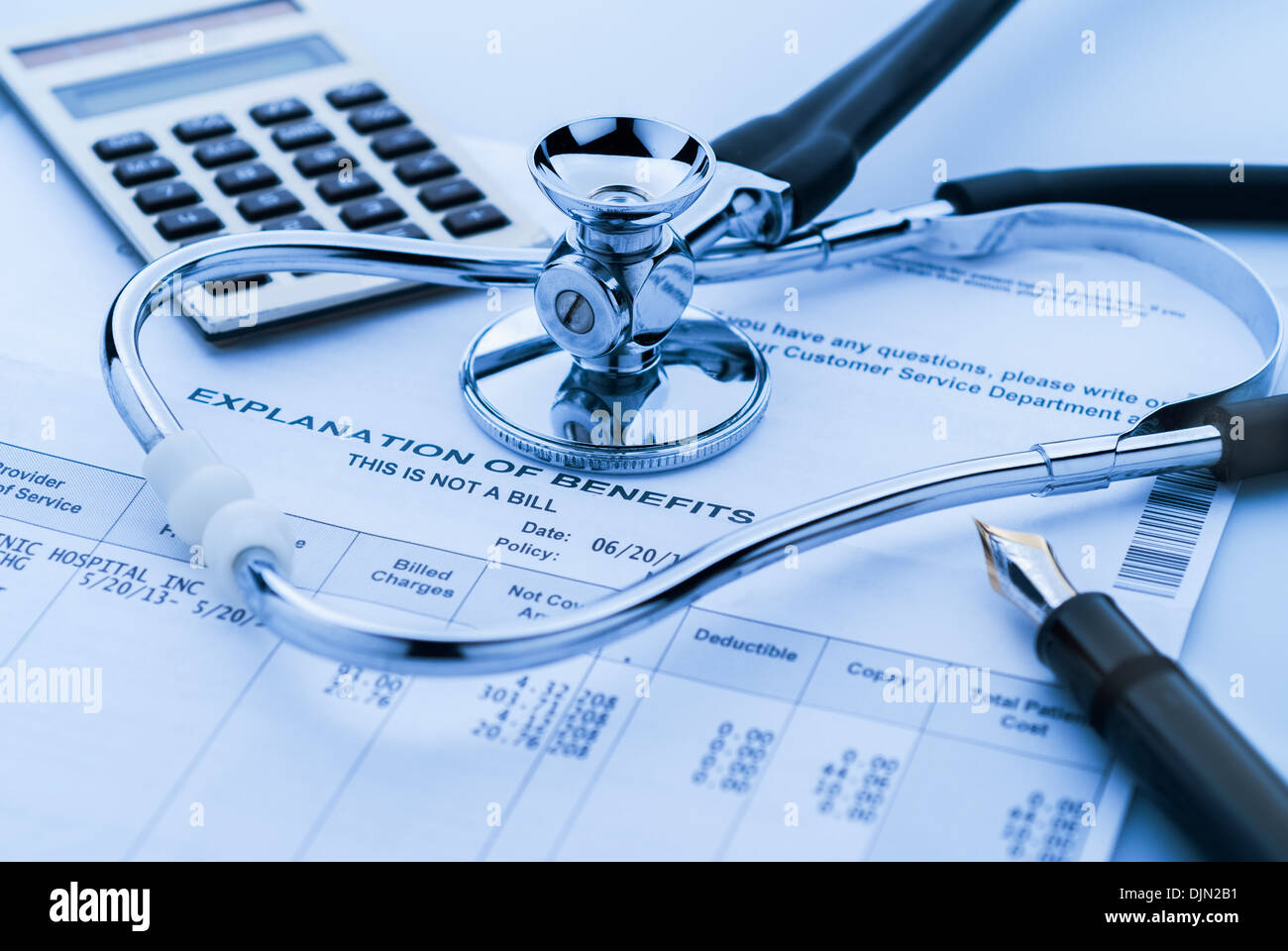 Cost of health care with stethoscope, calculator and pen Stock Photo