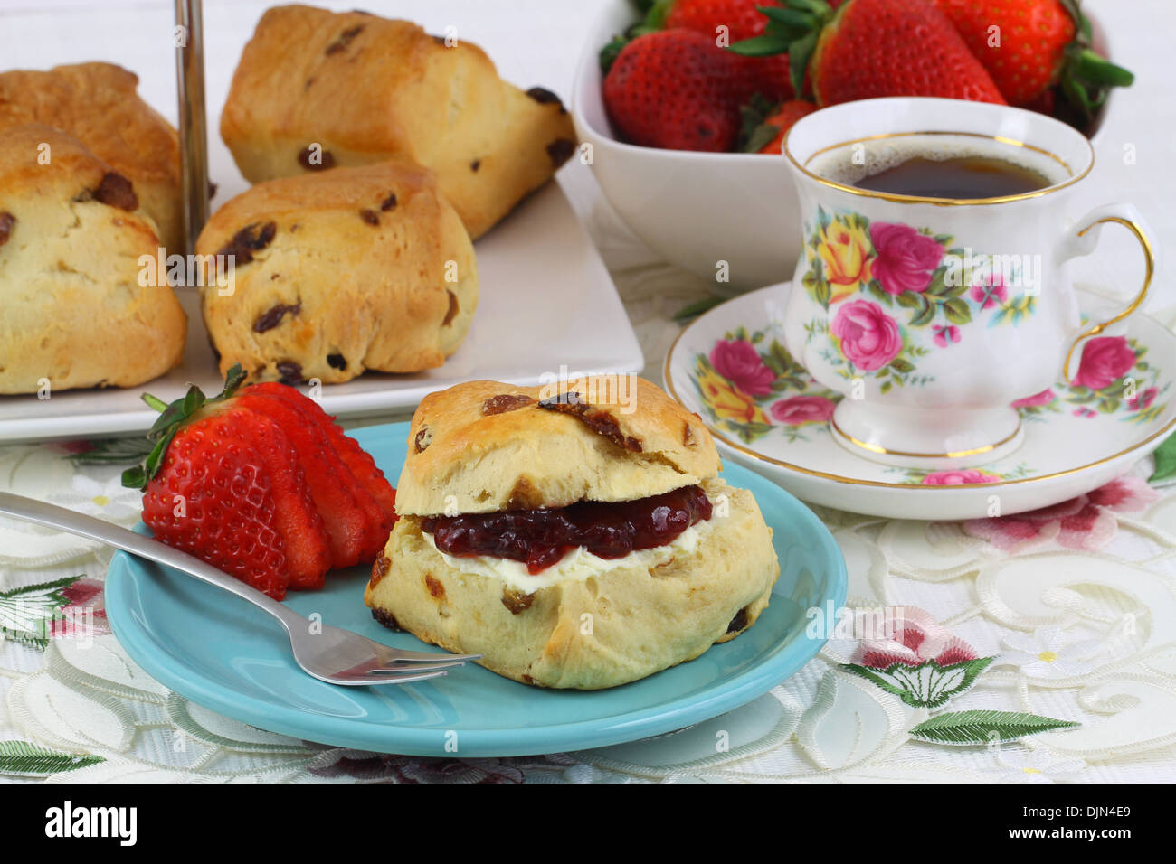 Scone with jam and clotted cream Stock Photo