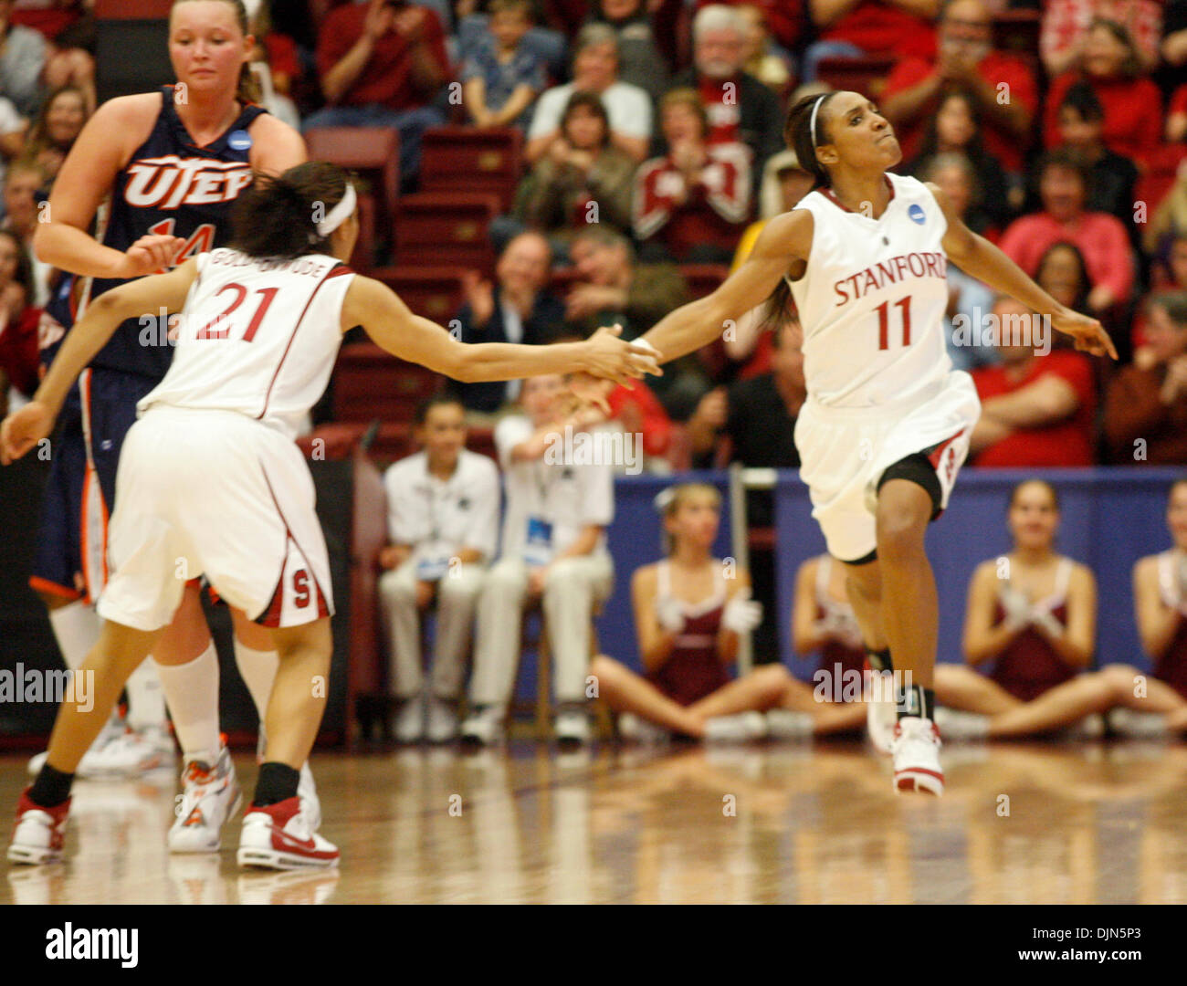 Stanford's Candice Wiggins, right, gets a congratulatory handshake from teammate Rosalyn Gold-Onwude in the half of their second-round NCAA tournament college basketball game, Monday, March 24, 2008 at Maples Pavilion in Palo Alto, Calif.  Stanford won, 88-54. (D. Ross Cameron/The Oakland Tribune) Stock Photo