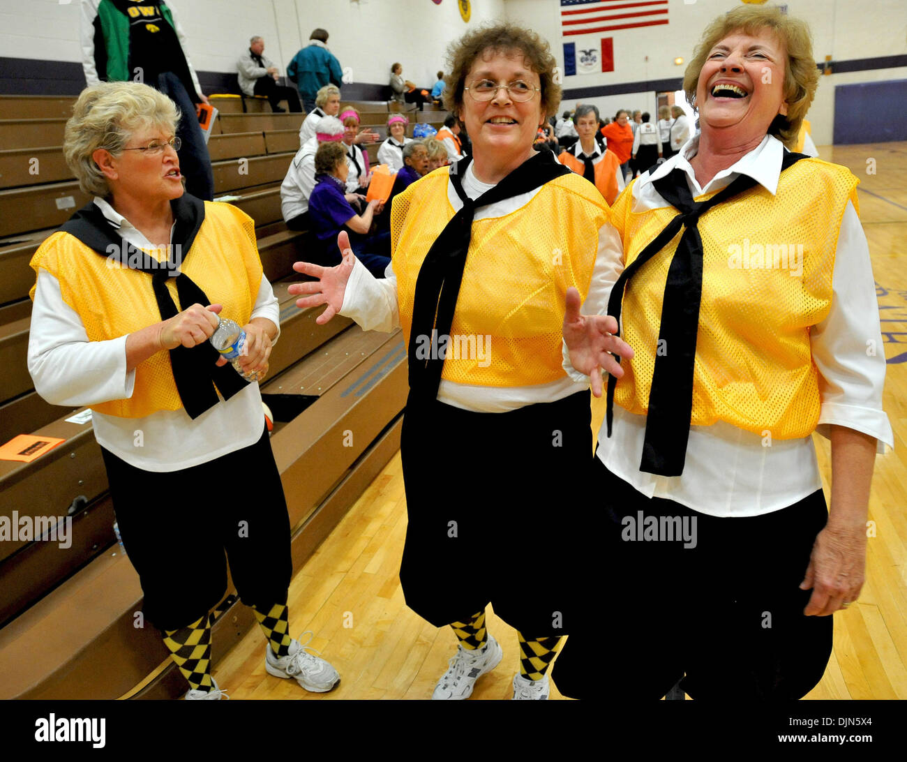 Mar 29, 2008 - Alburnett, Iowa, USA - Left to right, CAROLYN VEENSTRA, PAT DUER, and JEAN O'MALIA of the Ankey Honey Bees share a laugh after a Granny Basketball League game at the Alburnett High School gymnasium. Open to women over the age of 50, and played by rules modified from those established in the 1920's, granny basketball has become a mini-phenomenon in Iowa and other midw Stock Photo