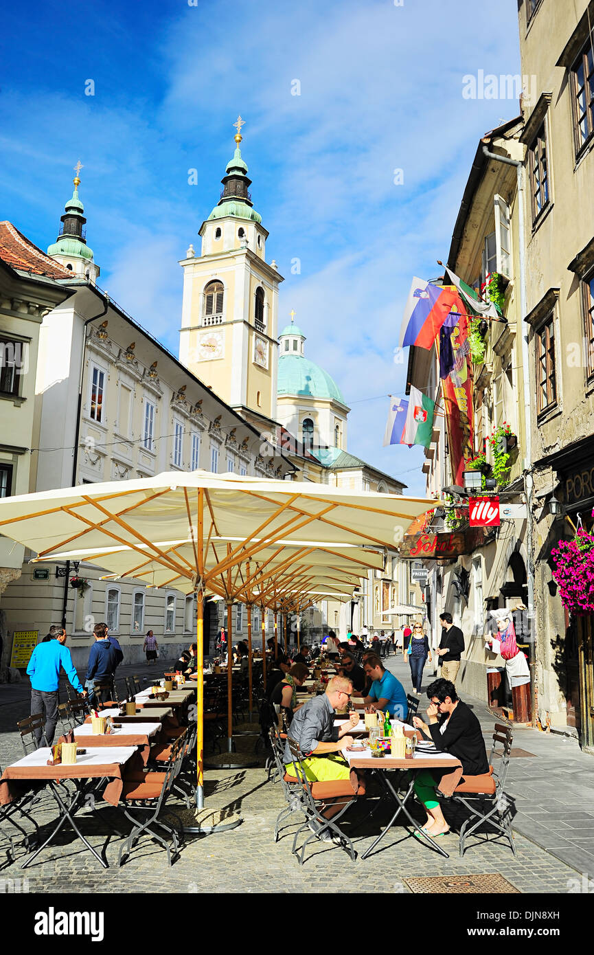 People at street cafe in old town of Ljubljana, Slovenia. Stock Photo