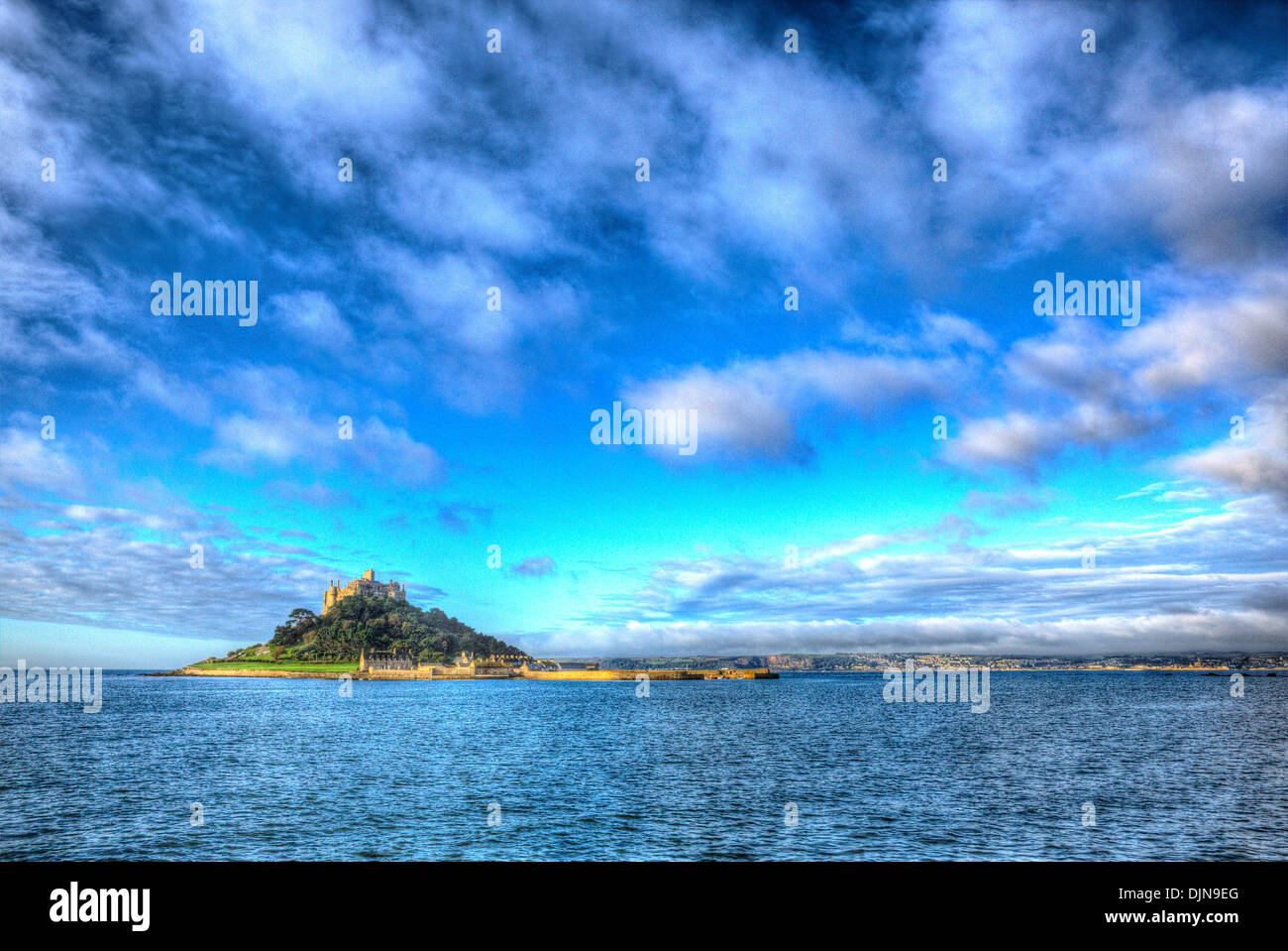 Medieval castle on island St Michaels Mount Cornwall England with vivid Cloudscape in HDR like painting Stock Photo